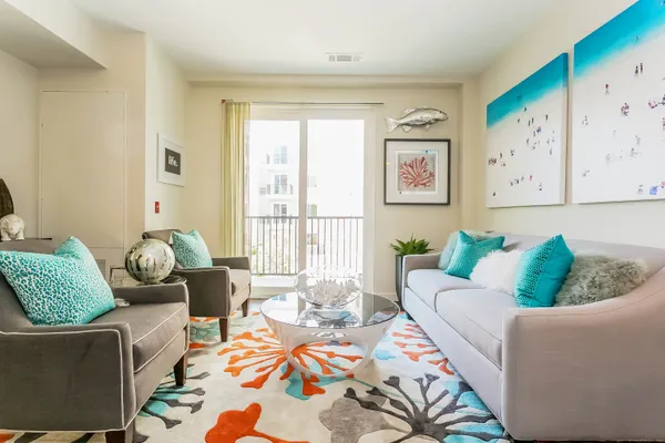 a living room with furniture and a window