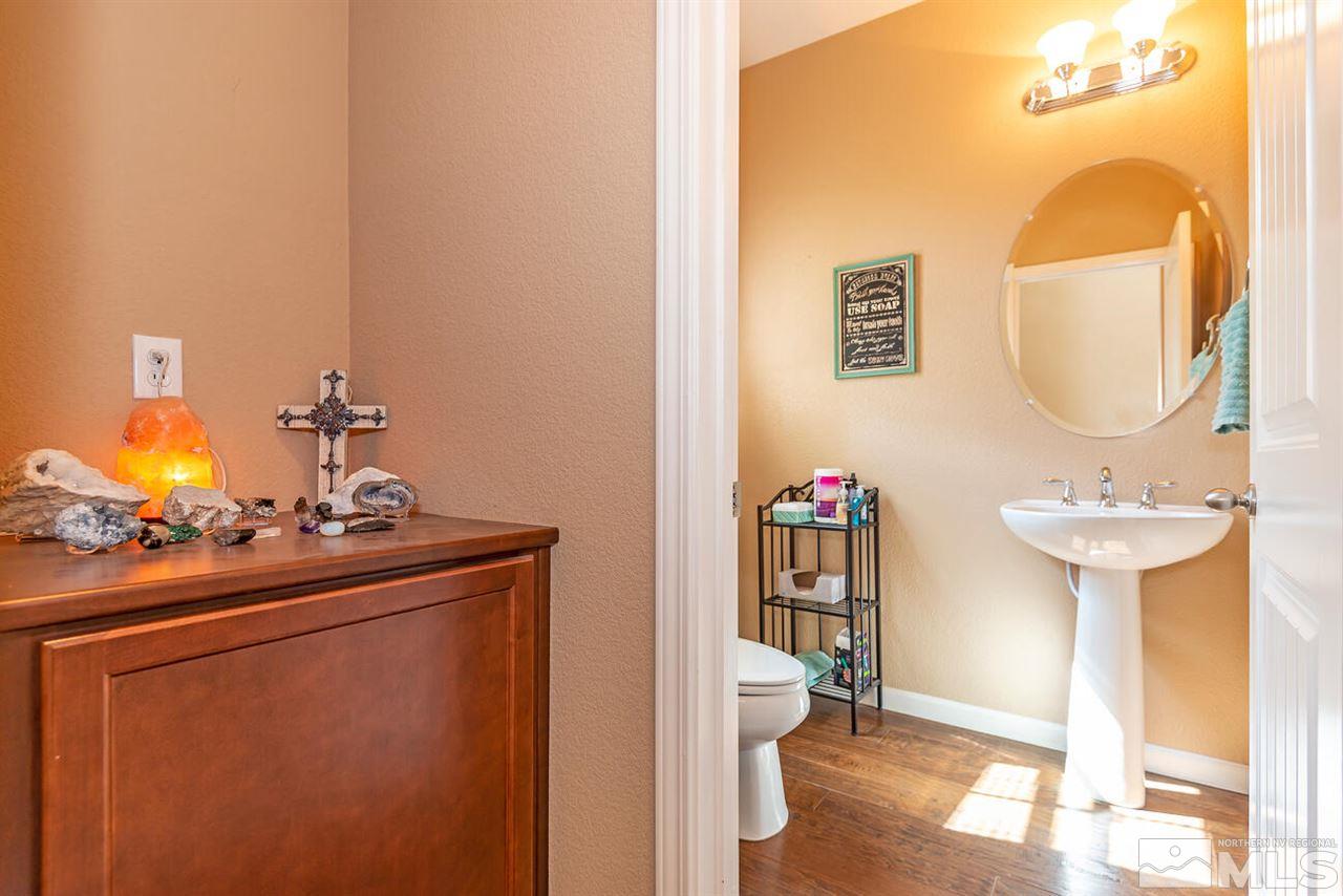 2065 Bears Ranch Drive Reno, NV 89521 - Photo 15 of 20 a bathroom with a sink mirror and toilet