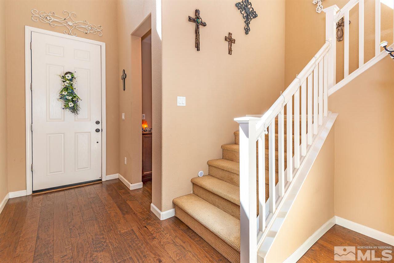 2065 Bears Ranch Drive Reno, NV 89521 - Photo 17 of 20 a view of a hallway with wooden floor and staircase