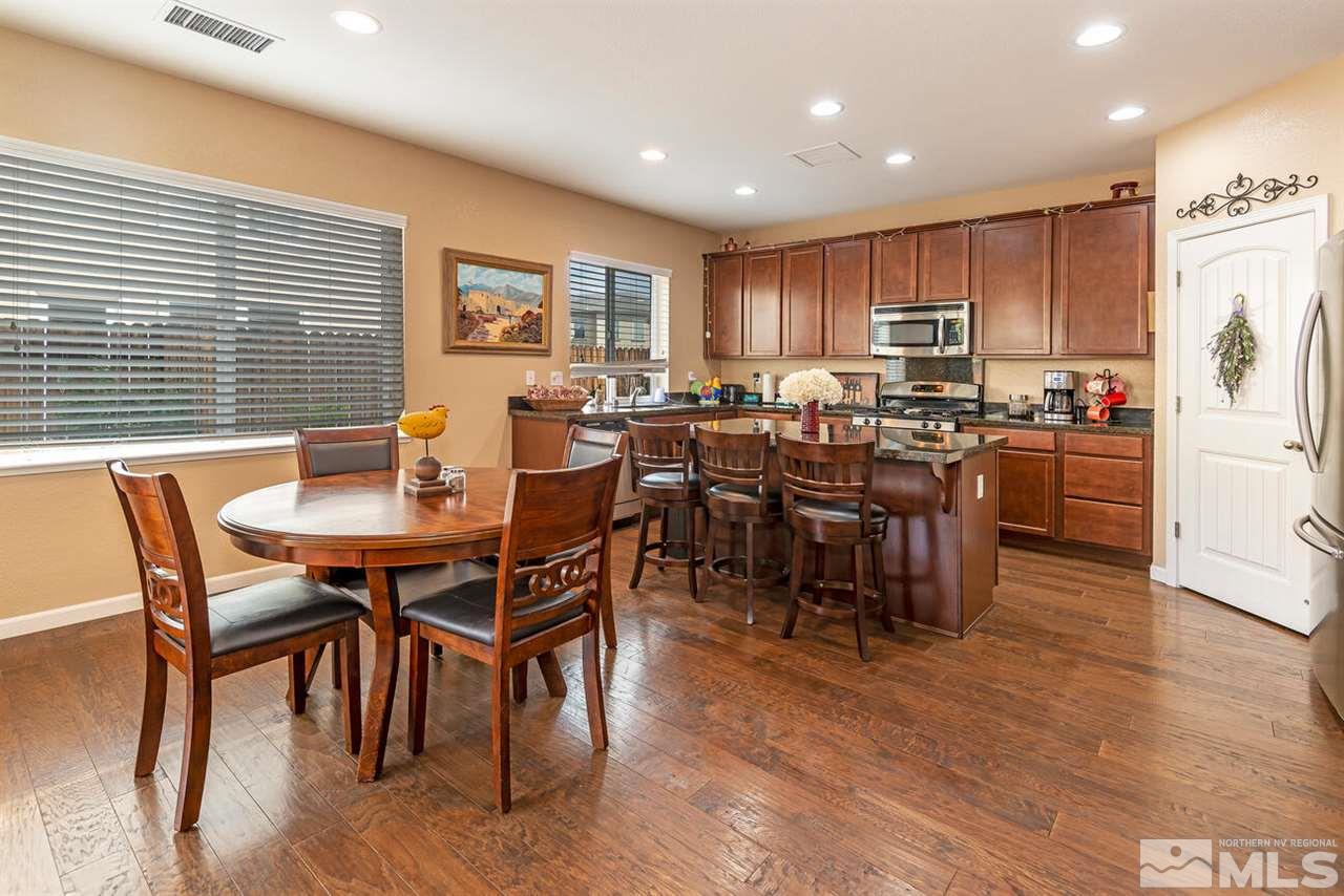 2065 Bears Ranch Drive Reno, NV 89521 - Photo 4 of 20 a view of a dining room with furniture window and wooden floor