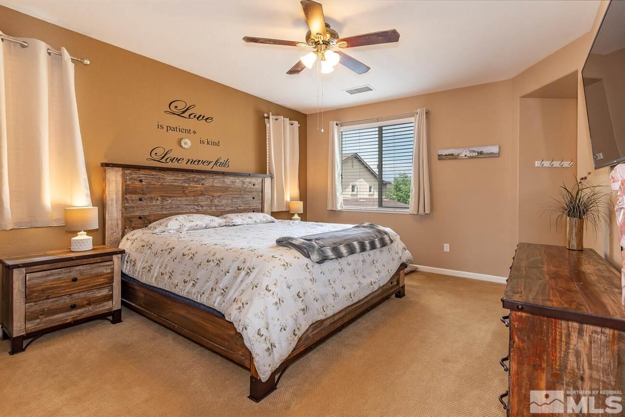 2065 Bears Ranch Drive Reno, NV 89521 - Photo 8 of 20 a bedroom with a bed dresser and a window