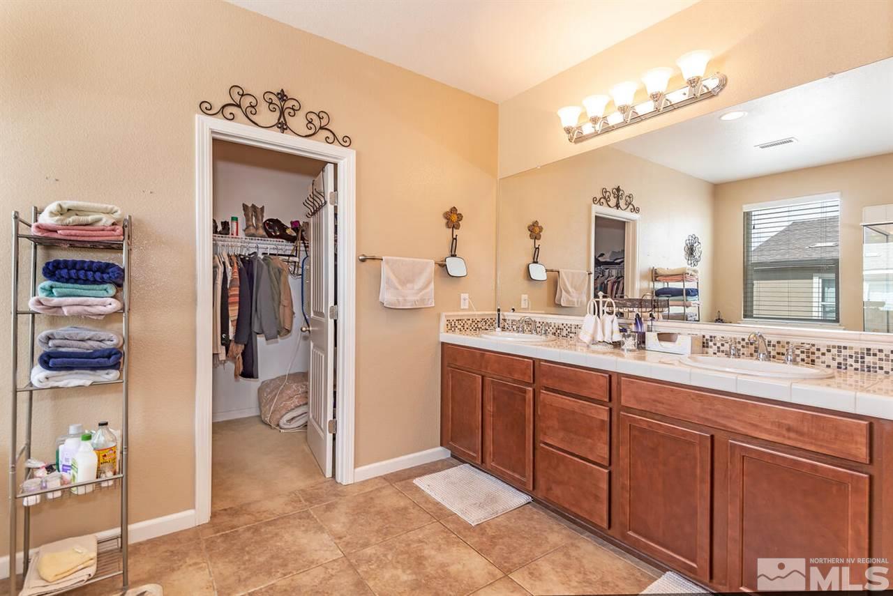 2065 Bears Ranch Drive Reno, NV 89521 - Photo 10 of 20 a bathroom with a sink and mirror