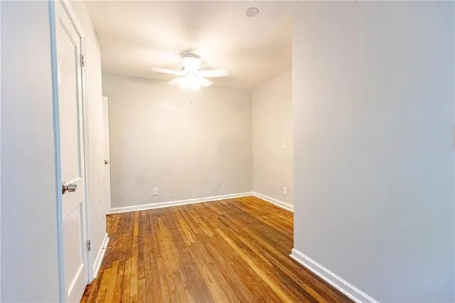 a view of room with wooden floor