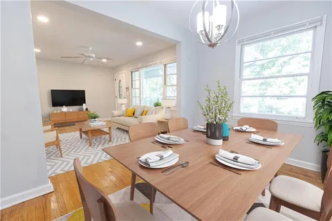 a view of a dining room with furniture window and outside view