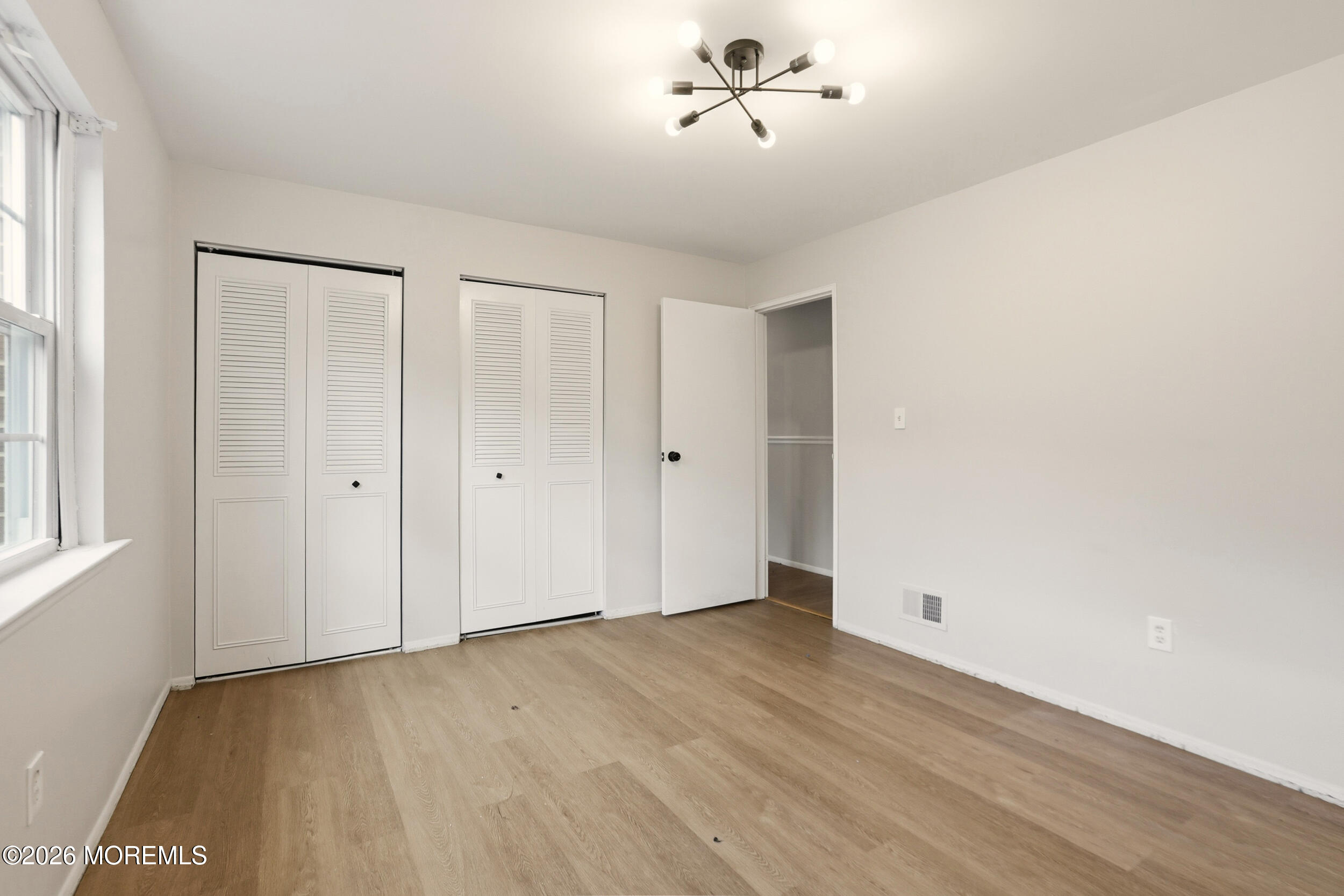 194 Sawmill Road, Unit 480 Brick, NJ 08724 - Photo 11 of 20 a view of an empty room with a window
