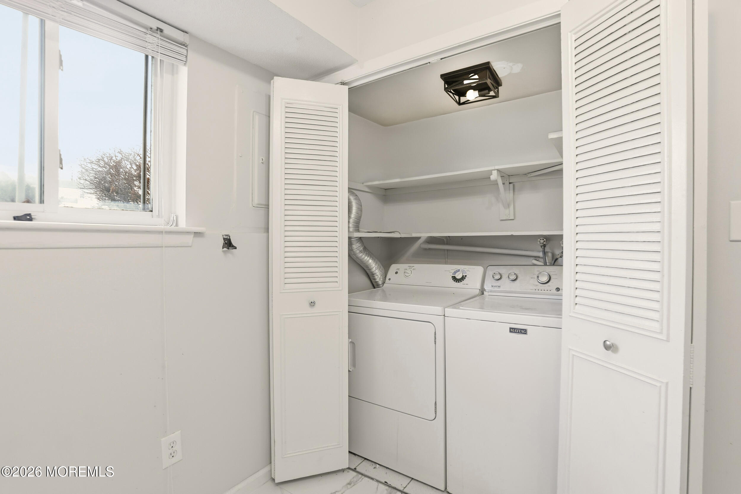 194 Sawmill Road, Unit 480 Brick, NJ 08724 - Photo 16 of 20 a utility room with dryer and washer