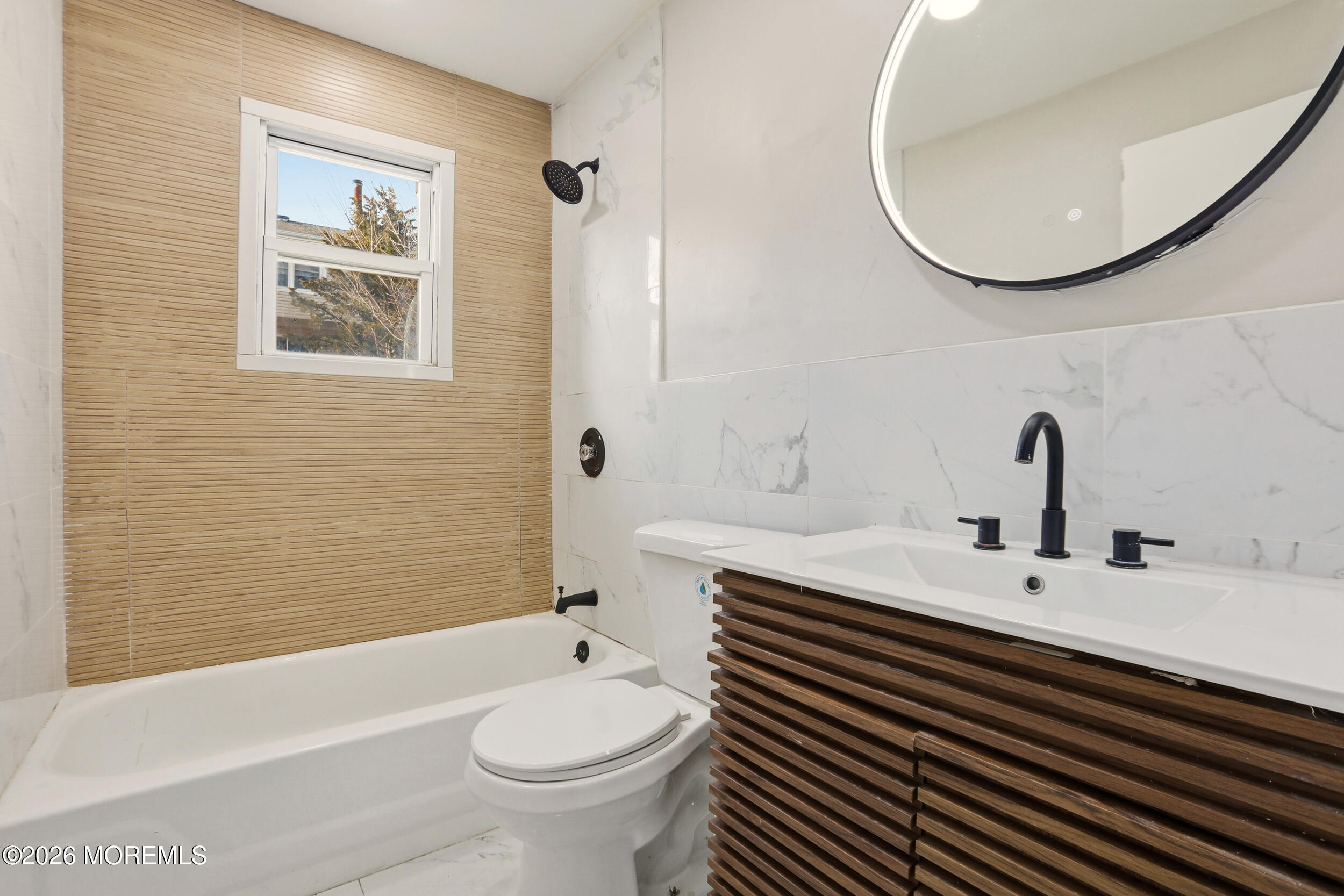 194 Sawmill Road, Unit 480 Brick, NJ 08724 - Photo 20 of 20 a bathroom with a sink a toilet and a mirror