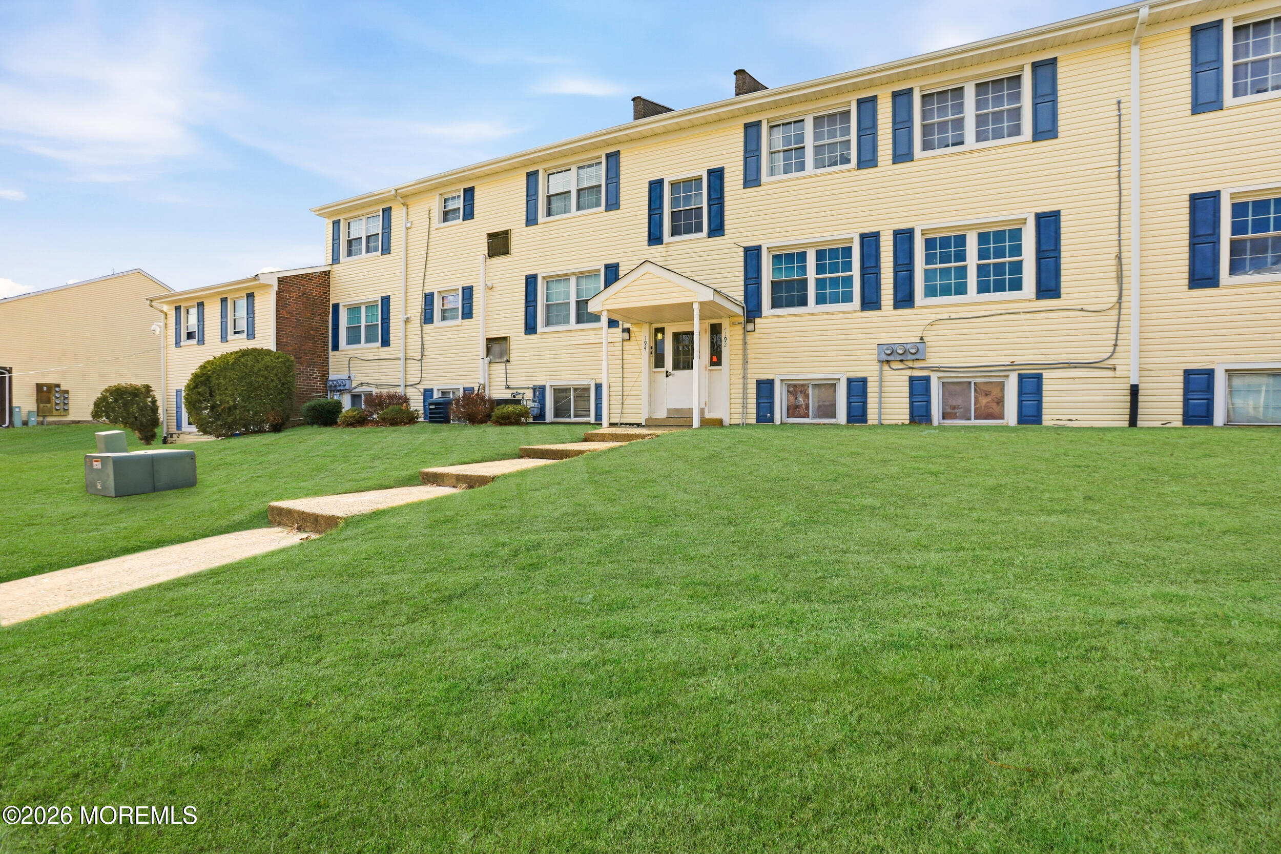 194 Sawmill Road, Unit 480 Brick, NJ 08724 - Photo 3 of 20 a large building with a yard