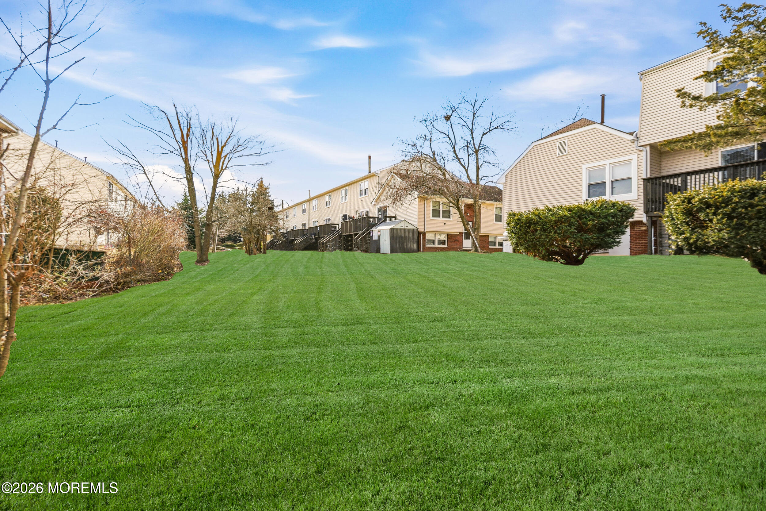 194 Sawmill Road, Unit 480 Brick, NJ 08724 - Photo 5 of 20 a view of a house with a big yard and large trees