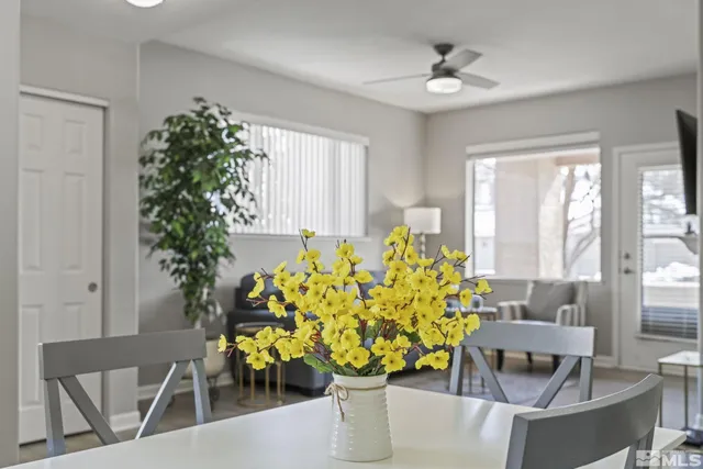 a vase of flowers sitting on a table in a room