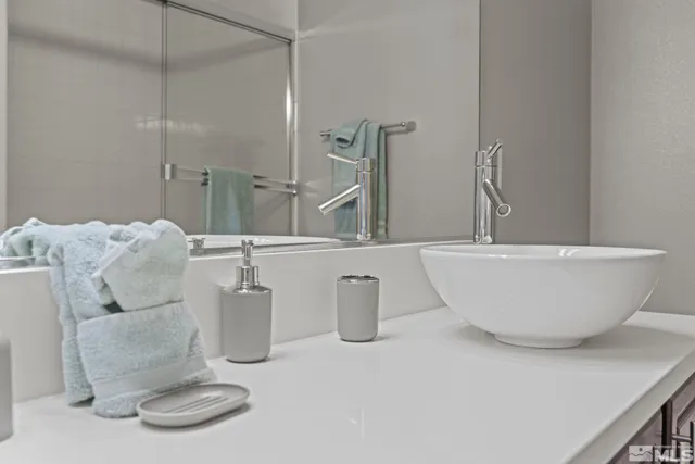 a white bath tub sitting next to a white toilet