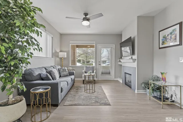 a living room with furniture and a large window