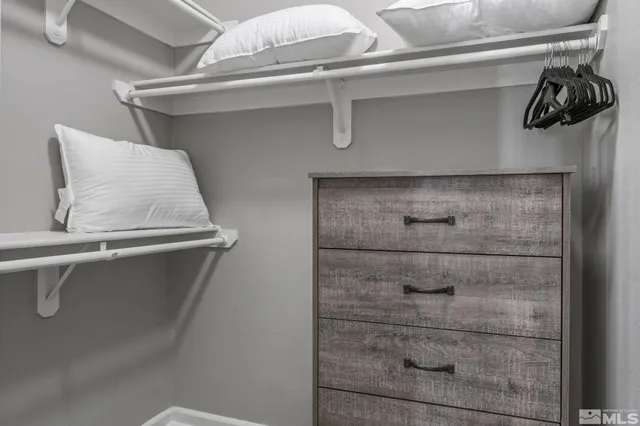 a bathroom with a sink a mirror toilet and bathtub