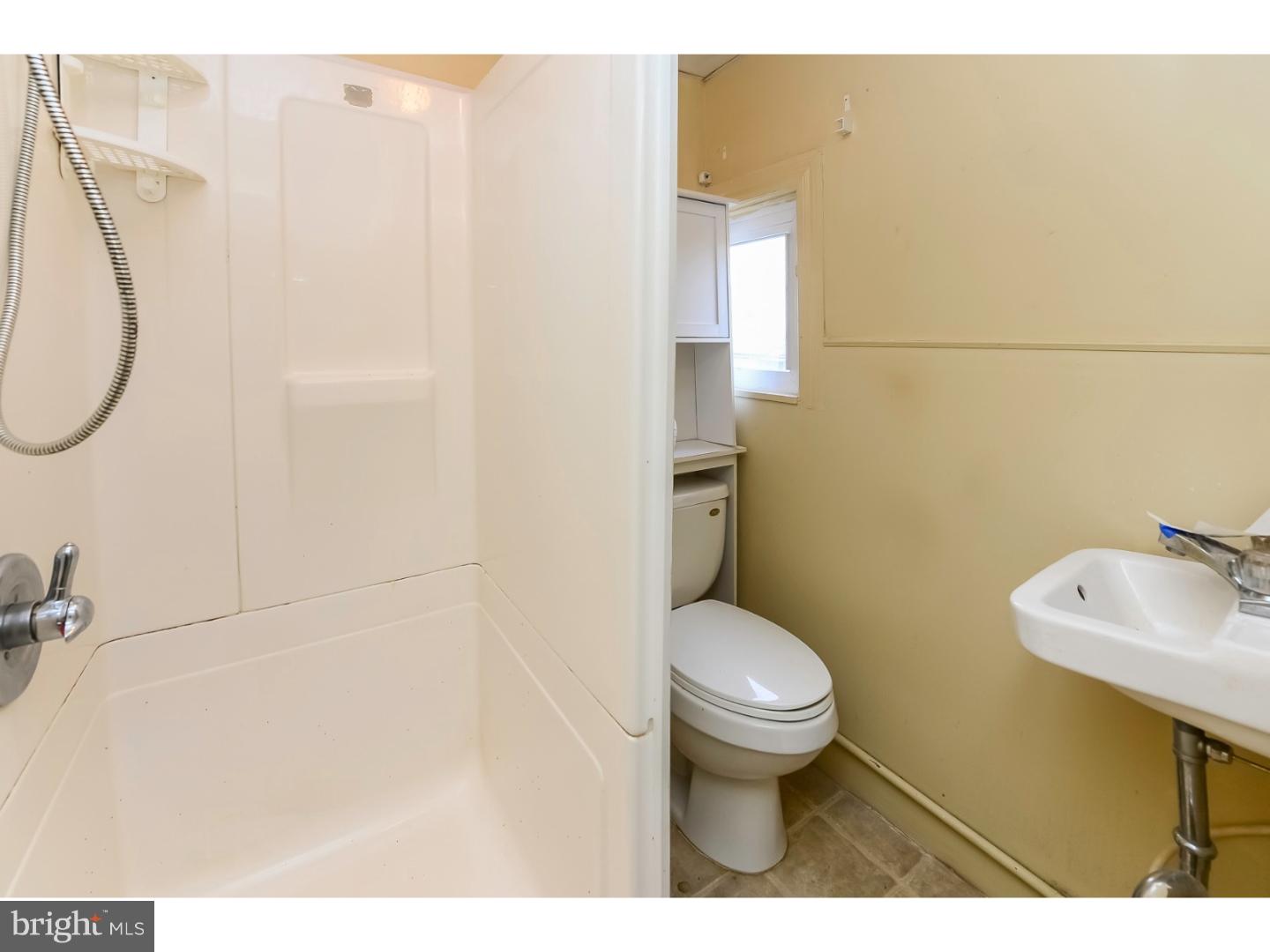 200 Pitman Avenue Pitman, NJ 08071 - Photo 15 of 59 a bathroom with a sink toilet and a mirror