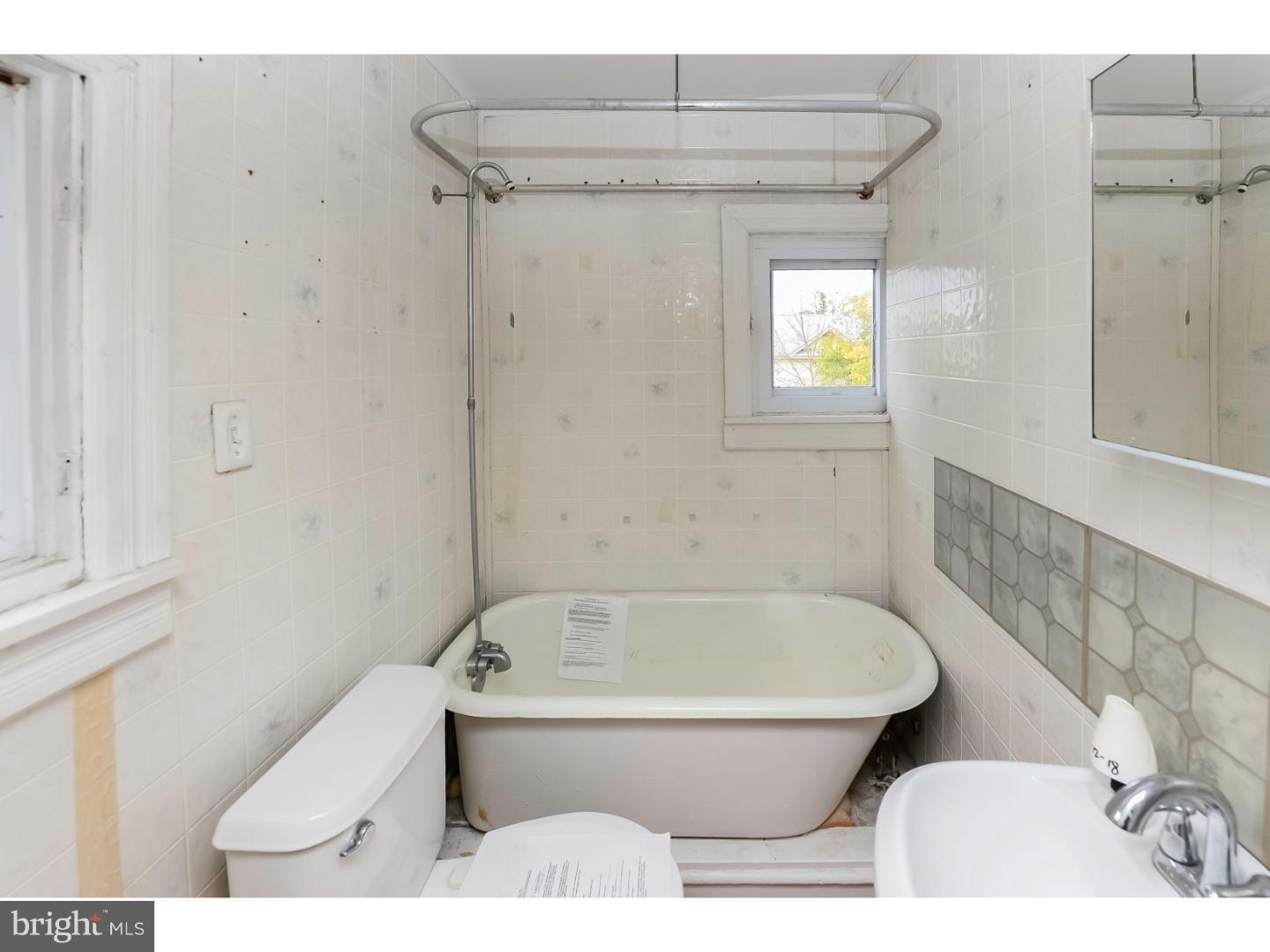 200 Pitman Avenue Pitman, NJ 08071 - Photo 19 of 59 a bathroom with a toilet and bathtub