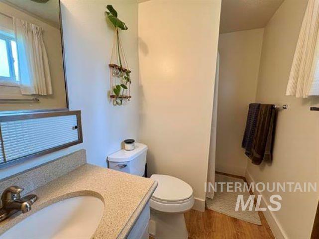 3197 Neeley Road American Falls, ID 83211 - Photo 24 of 45 Bathroom vanity featuring a light-toned speckled countertop and a single basin sink