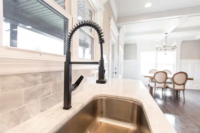 a bathroom with a sink a mirror and vanity