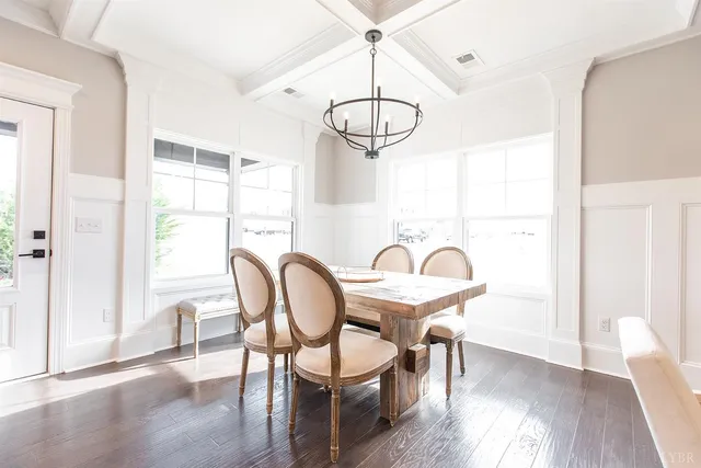 a living room with fireplace furniture and a wooden floor