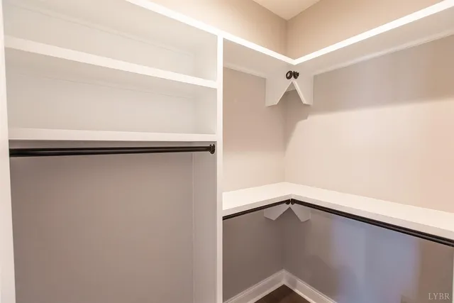 a view of empty room with ceiling fan