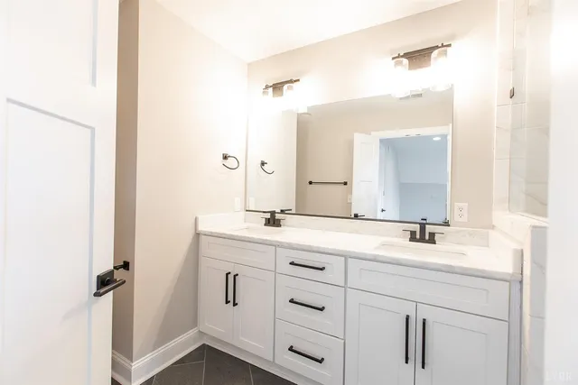 a front view of a house with white wall and door