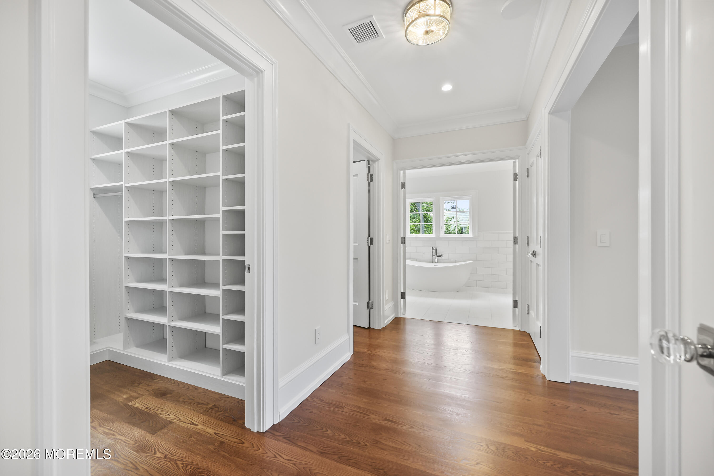 4 Club Way Rumson, NJ 07760 - Photo 19 of 79 a view of an empty room with wooden floor and a window