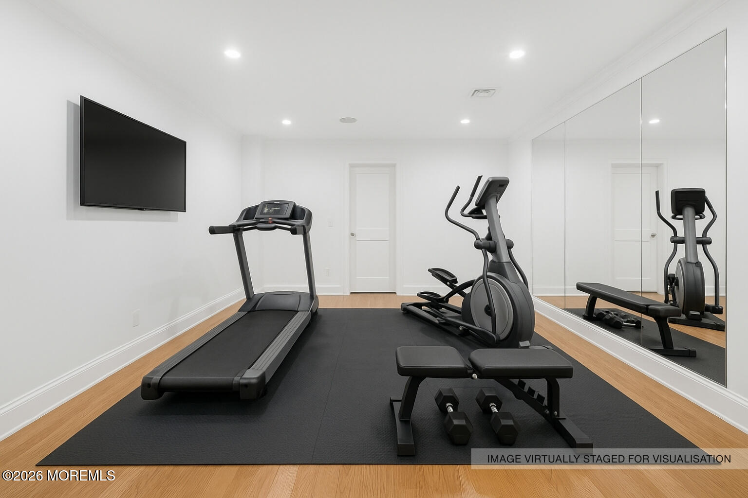 4 Club Way Rumson, NJ 07760 - Photo 26 of 79 a room with gym equipment and a flat screen tv