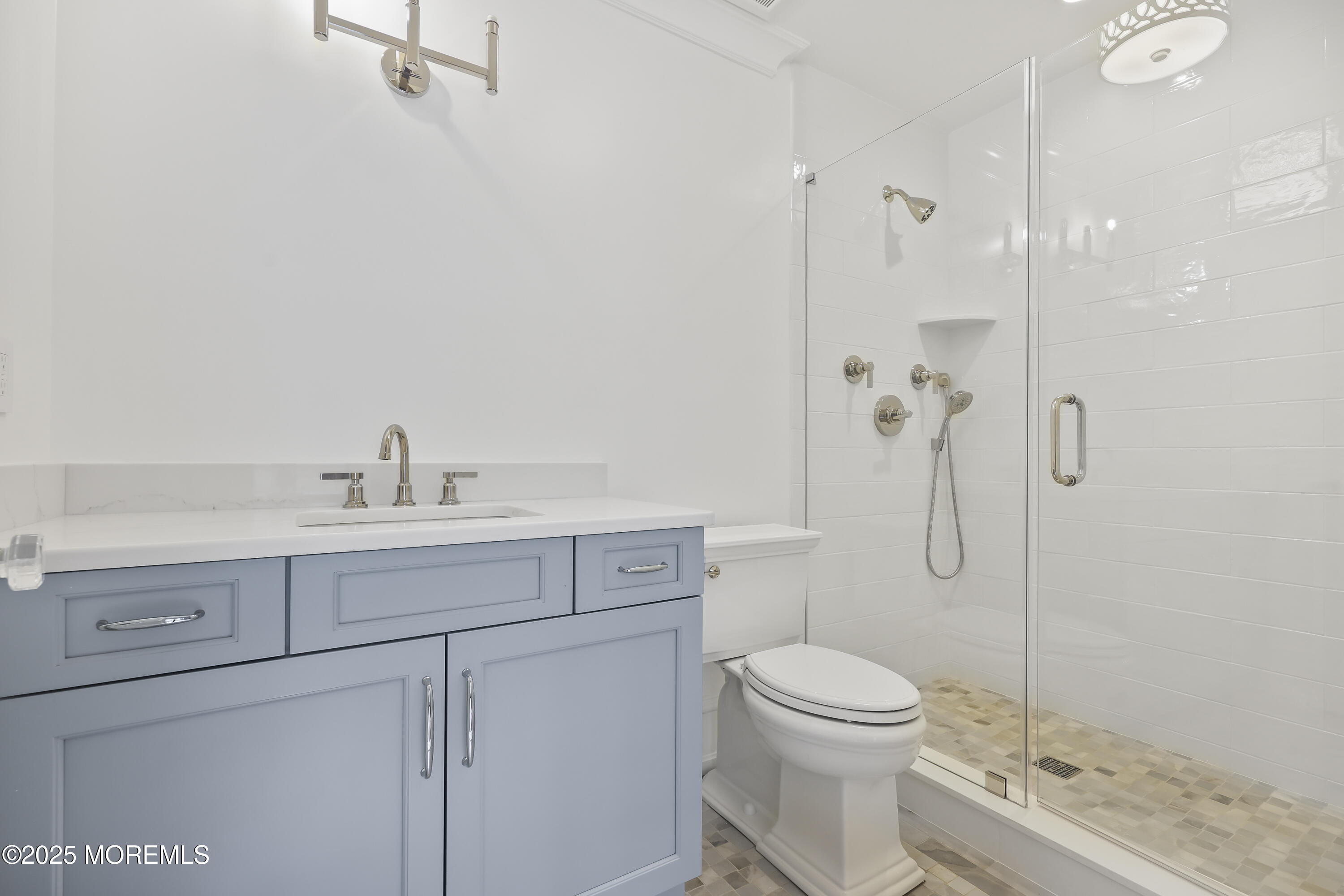 4 Club Way Rumson, NJ 07760 - Photo 30 of 79 a bathroom with a sink a toilet and shower