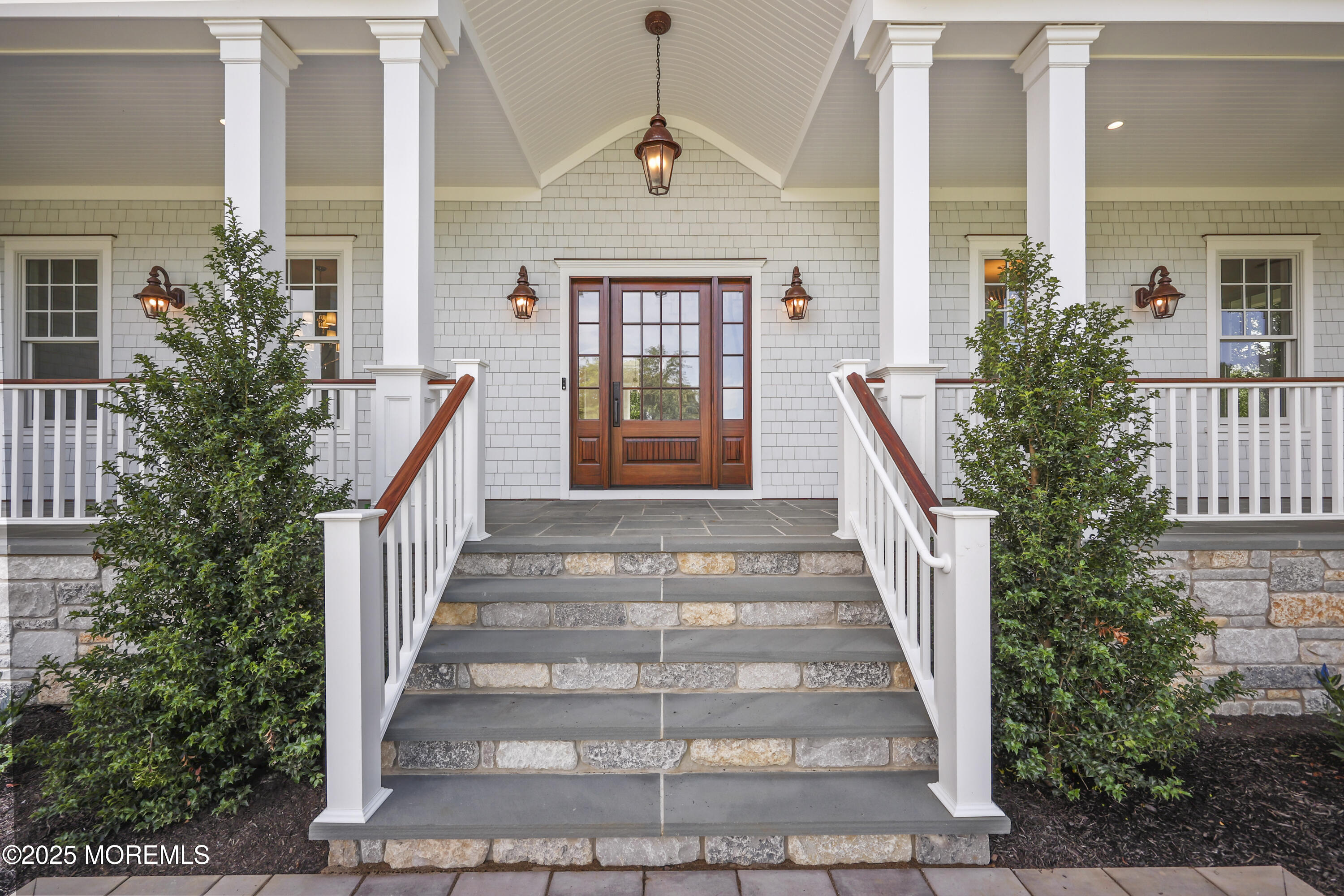 4 Club Way Rumson, NJ 07760 - Photo 3 of 79 a front view of a house with a porch