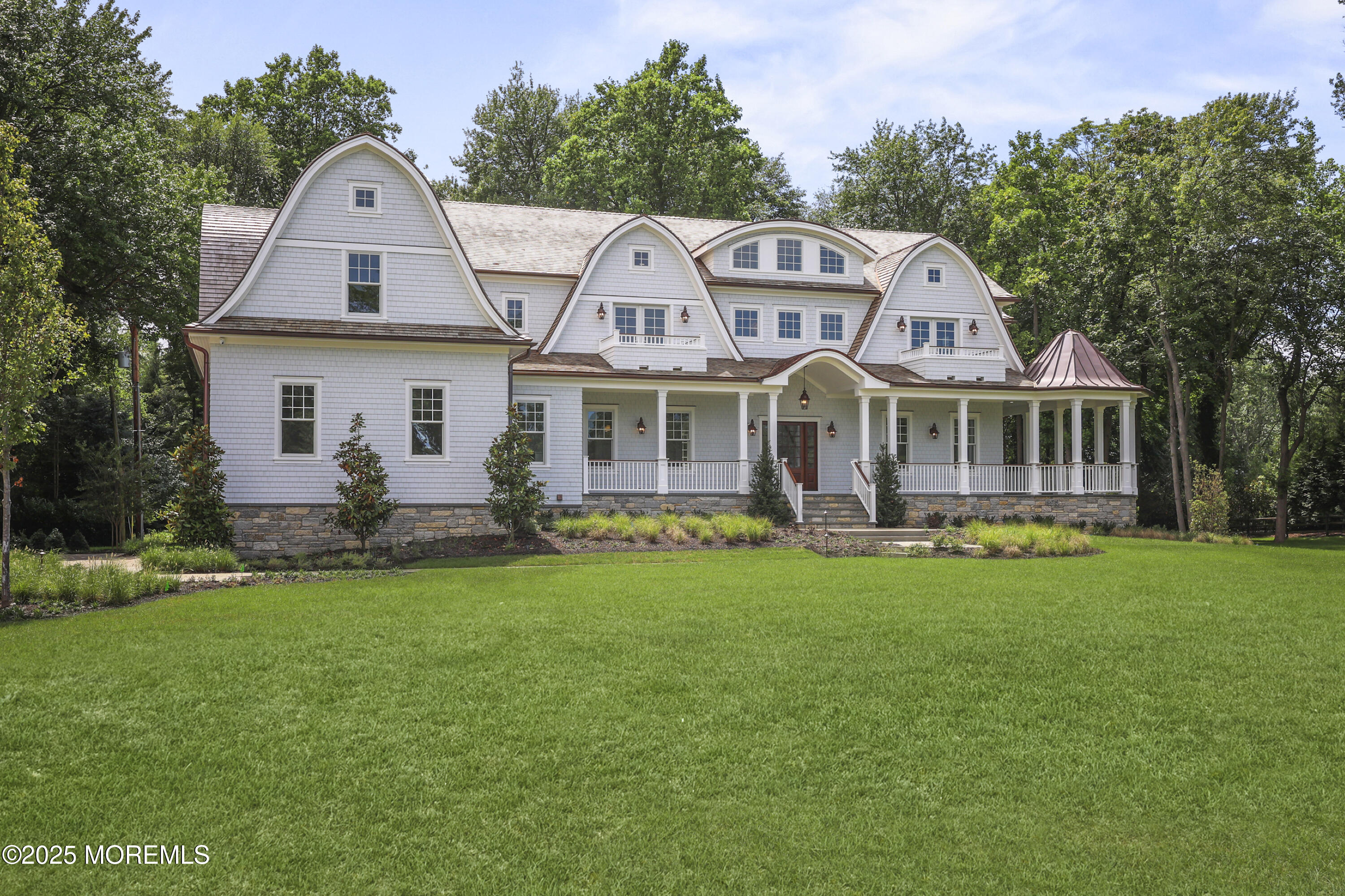 4 Club Way Rumson, NJ 07760 - Photo 34 of 79 a front view of a house with a garden