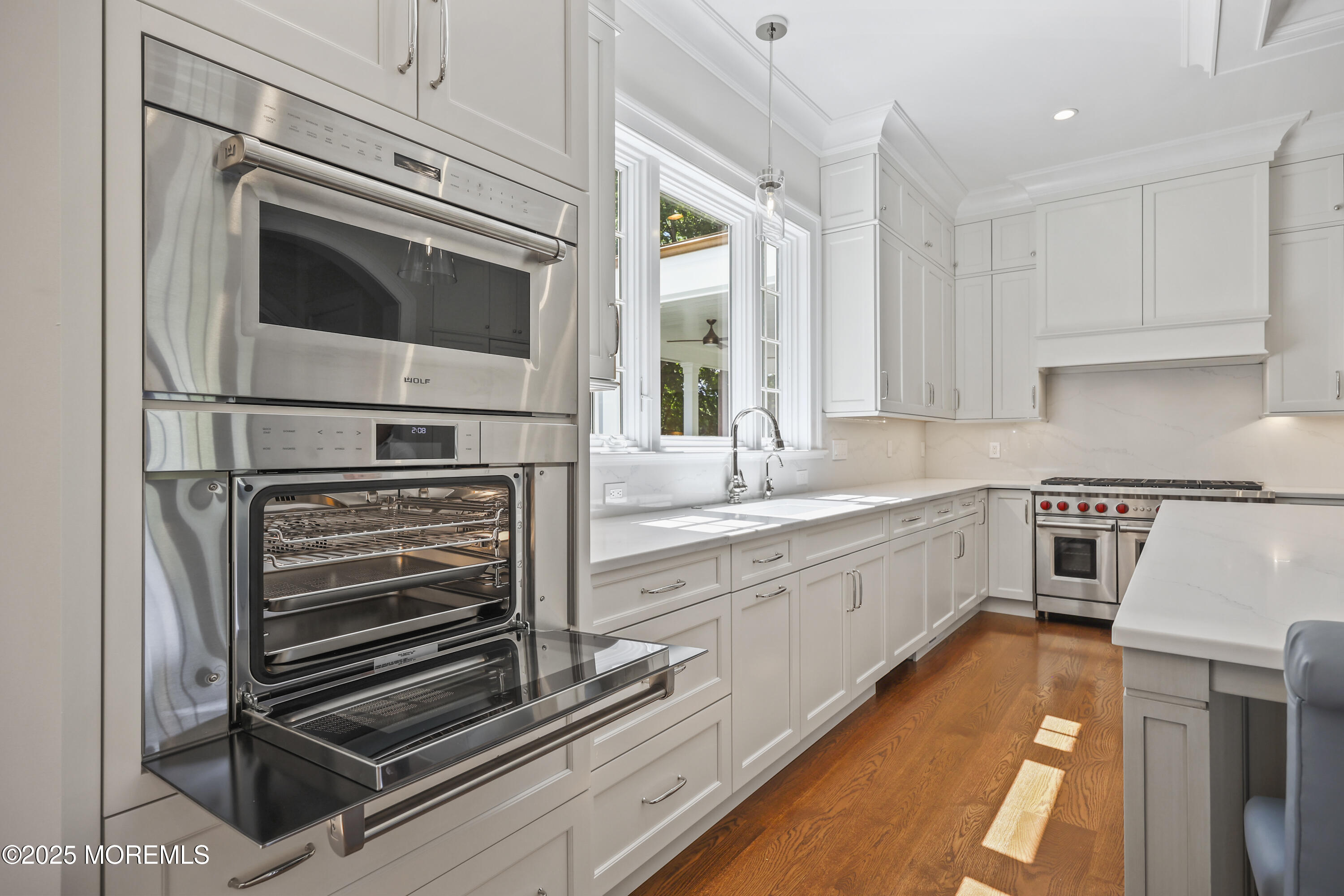 4 Club Way Rumson, NJ 07760 - Photo 37 of 79 a kitchen with stainless steel appliances a stove microwave and cabinets