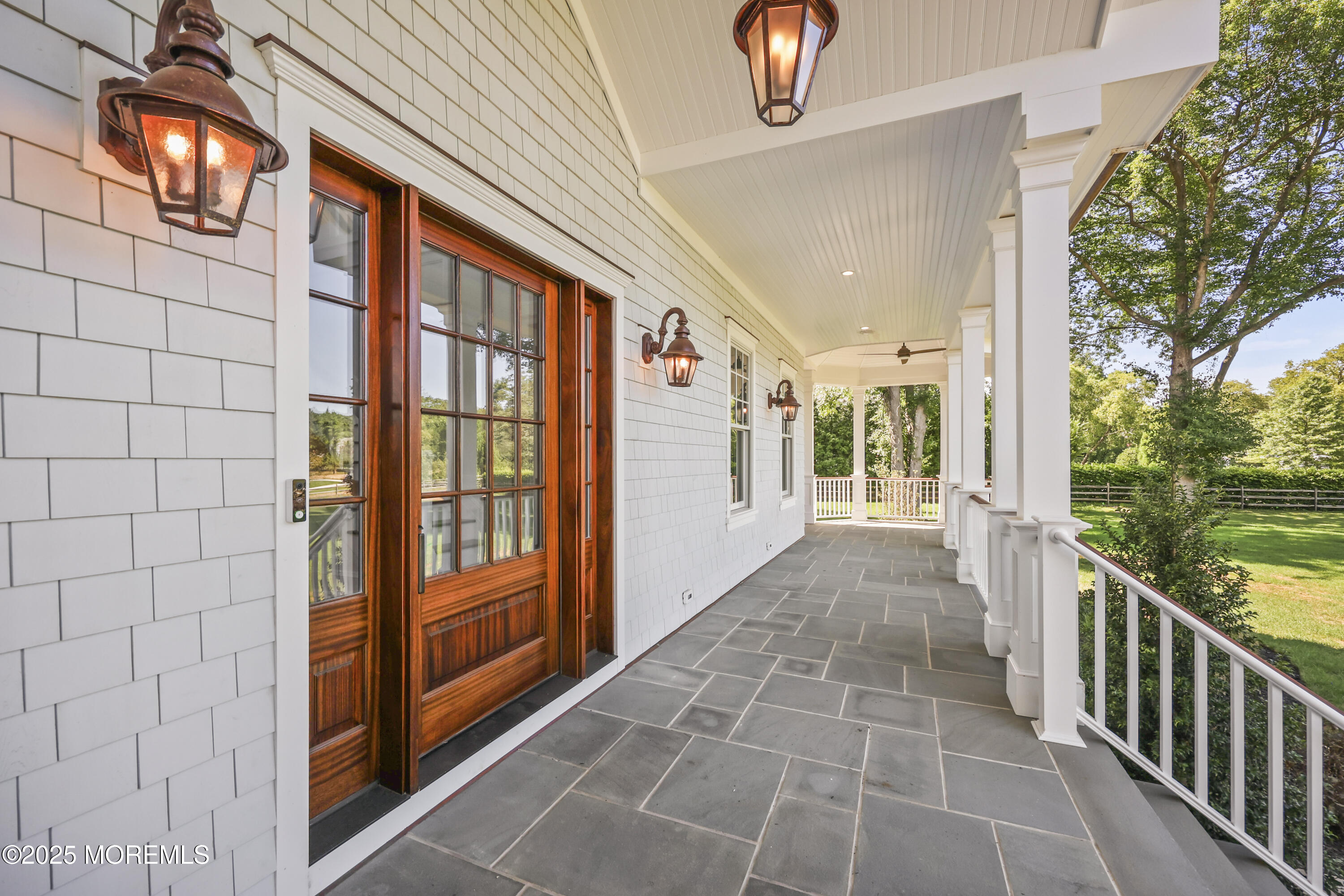4 Club Way Rumson, NJ 07760 - Photo 4 of 79 a view of a porch with wooden floor and outer view