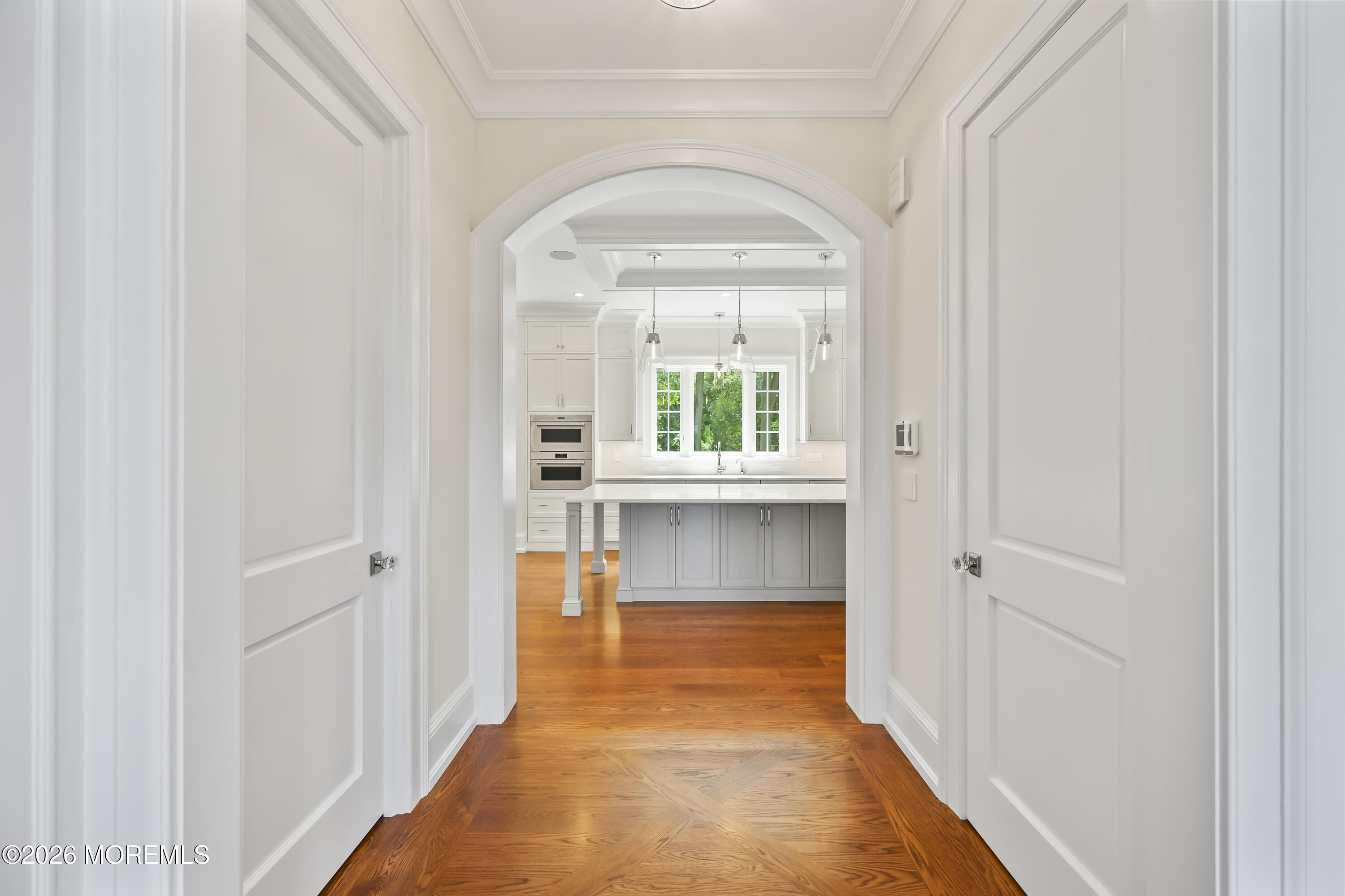 4 Club Way Rumson, NJ 07760 - Photo 5 of 79 a view of a hallway with wooden floor and a bathroom