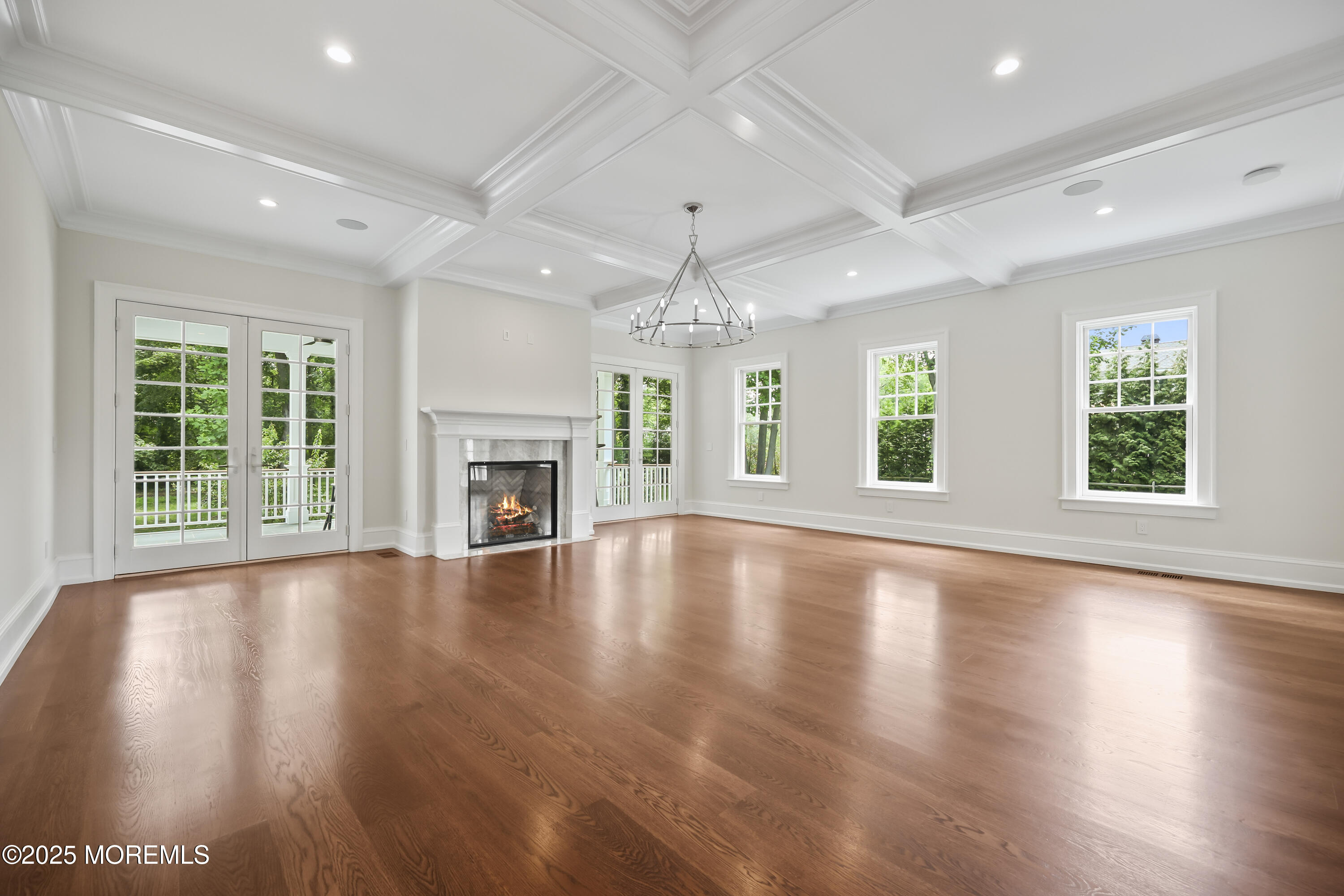 4 Club Way Rumson, NJ 07760 - Photo 65 of 79 an empty room with wooden floor fireplace and windows