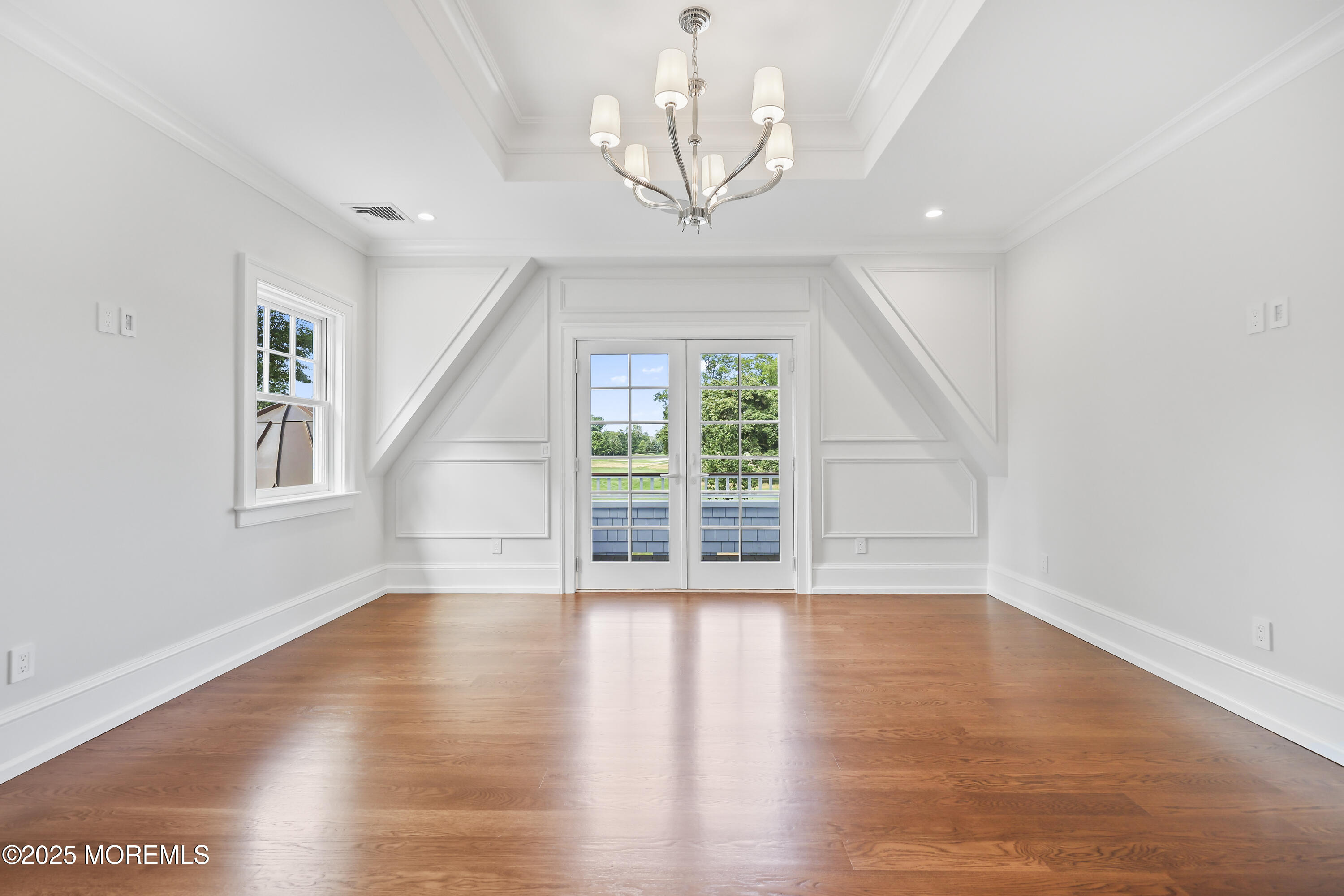 4 Club Way Rumson, NJ 07760 - Photo 73 of 79 a view of an empty room with wooden floor and a window
