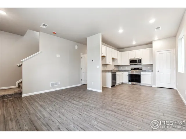 a view of kitchen with wooden floor