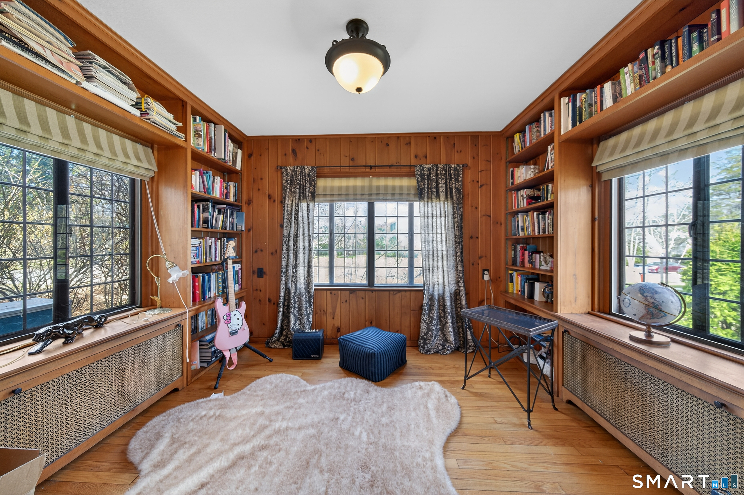 80 Santa Fe Avenue Hamden, CT 06517 - Photo 12 of 28 a living room filled with furniture and a large window