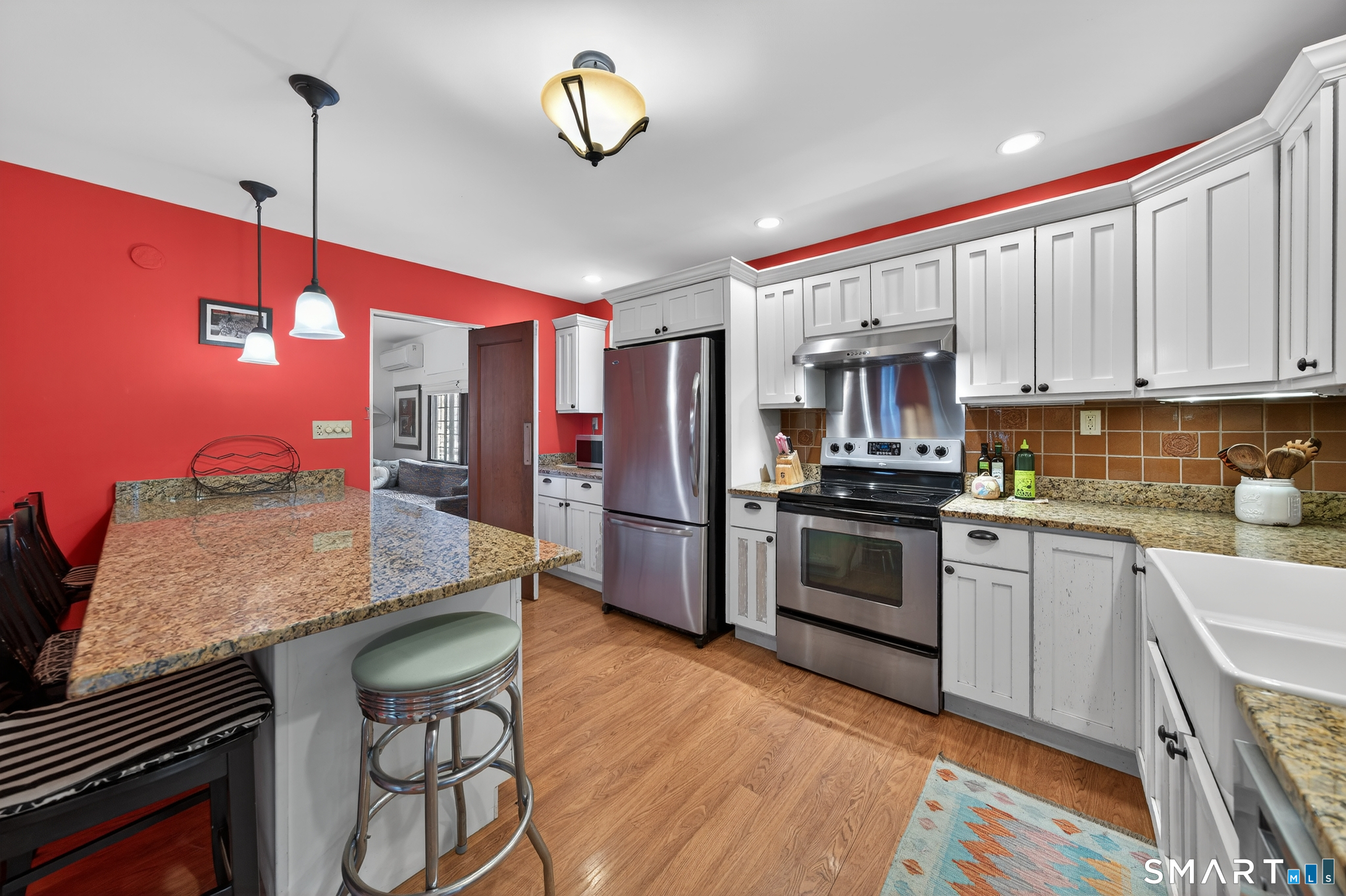 80 Santa Fe Avenue Hamden, CT 06517 - Photo 13 of 28 a kitchen with stainless steel appliances granite countertop a stove refrigerator and a sink