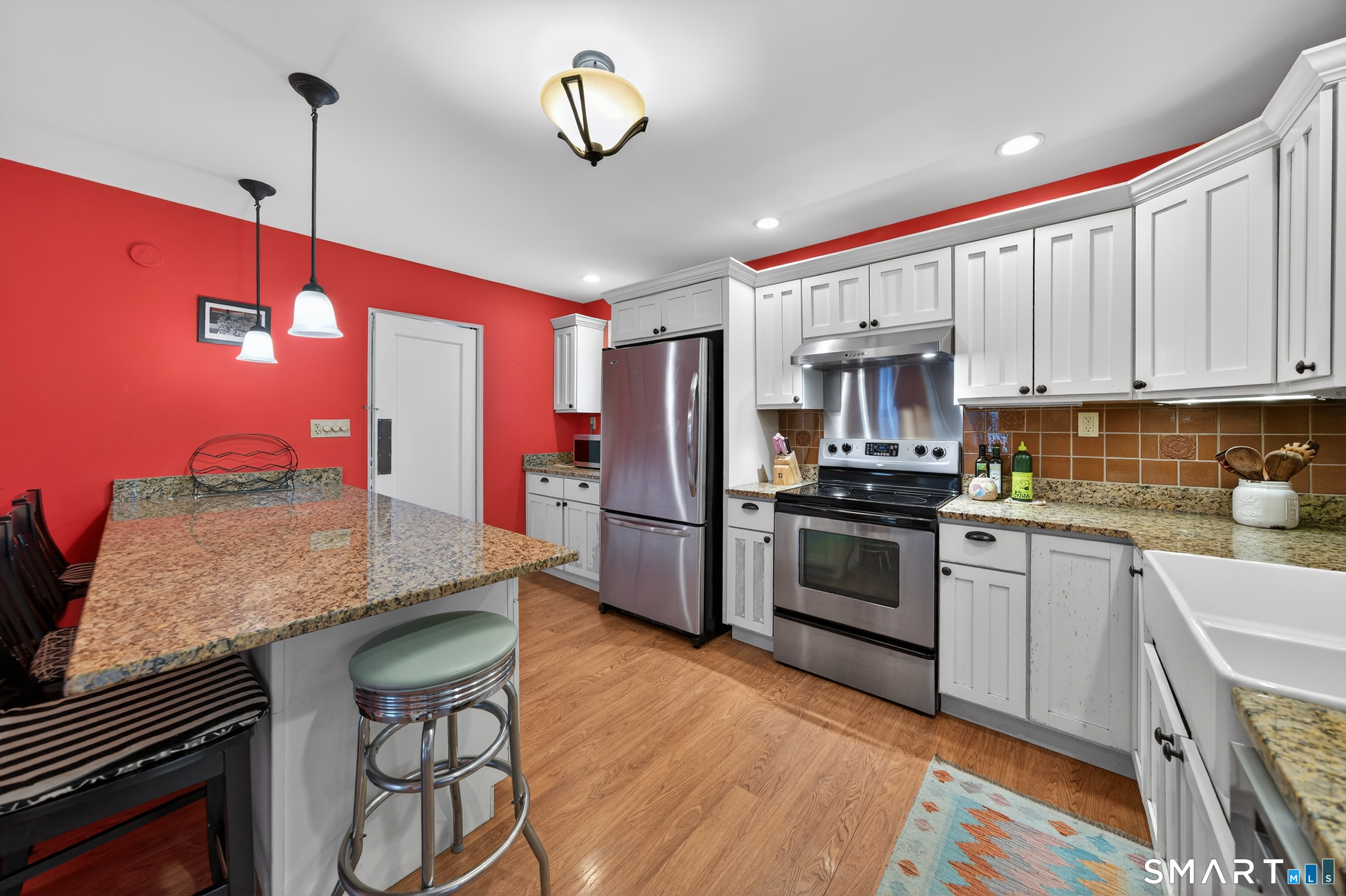 80 Santa Fe Avenue Hamden, CT 06517 - Photo 15 of 28 a kitchen with stainless steel appliances granite countertop a stove refrigerator and a sink