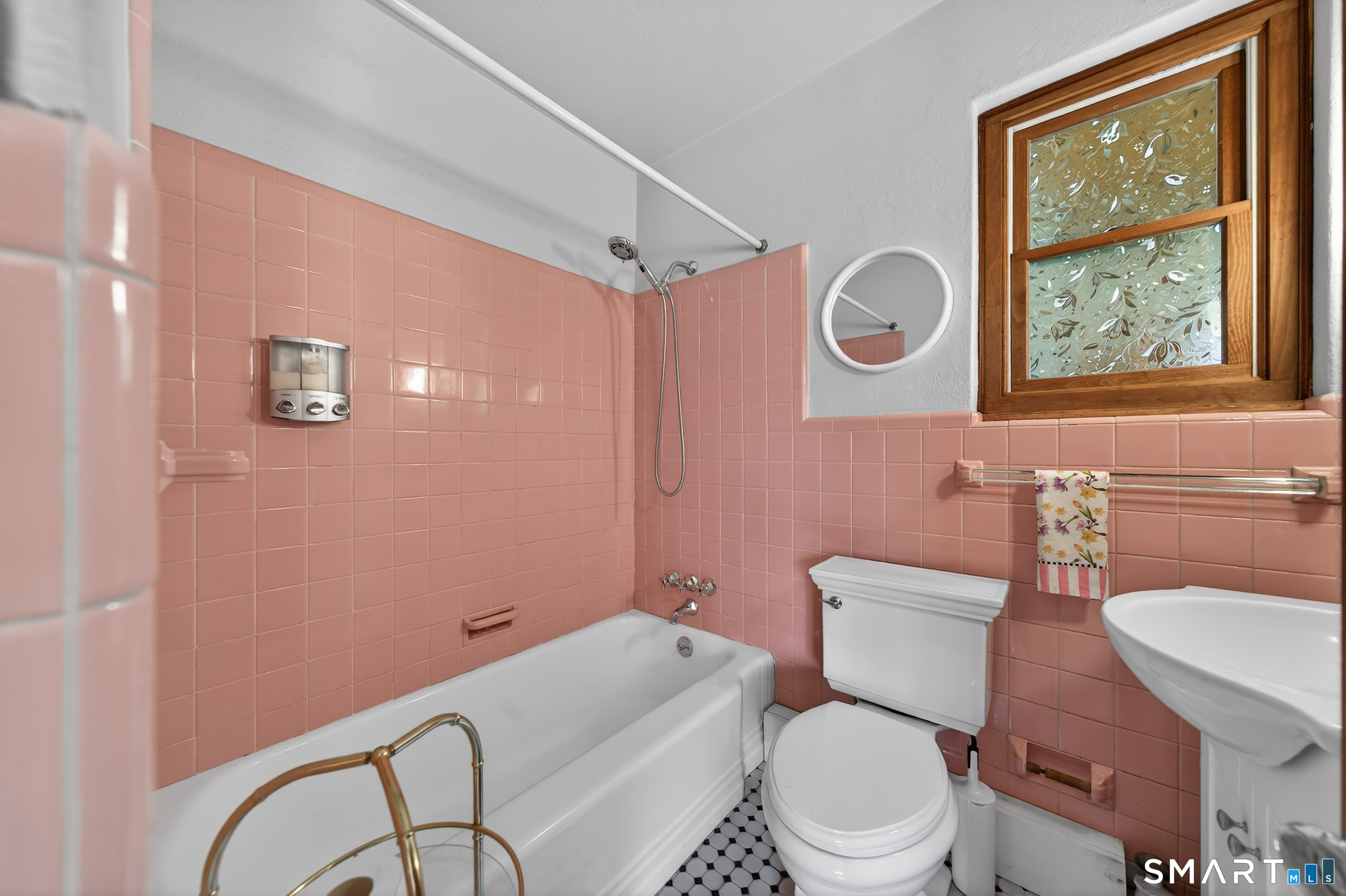 80 Santa Fe Avenue Hamden, CT 06517 - Photo 19 of 28 a bathroom with a toilet a sink and a mirror
