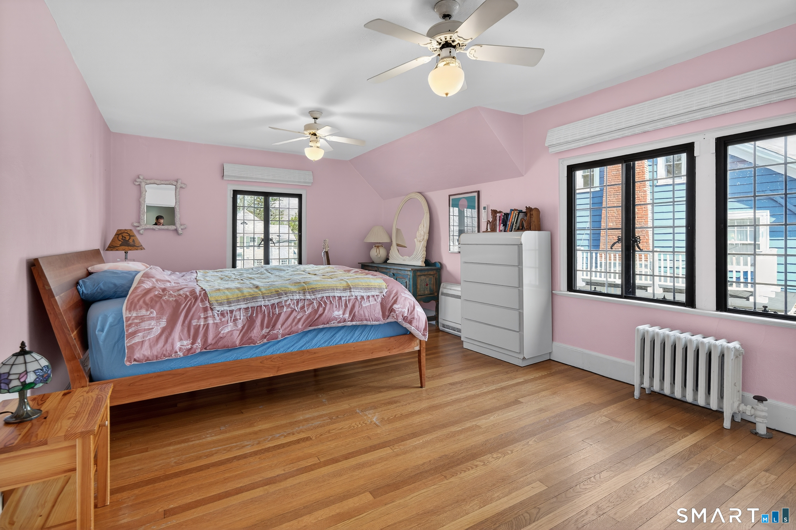 80 Santa Fe Avenue Hamden, CT 06517 - Photo 20 of 28 a bedroom with a bed chandelier and a window