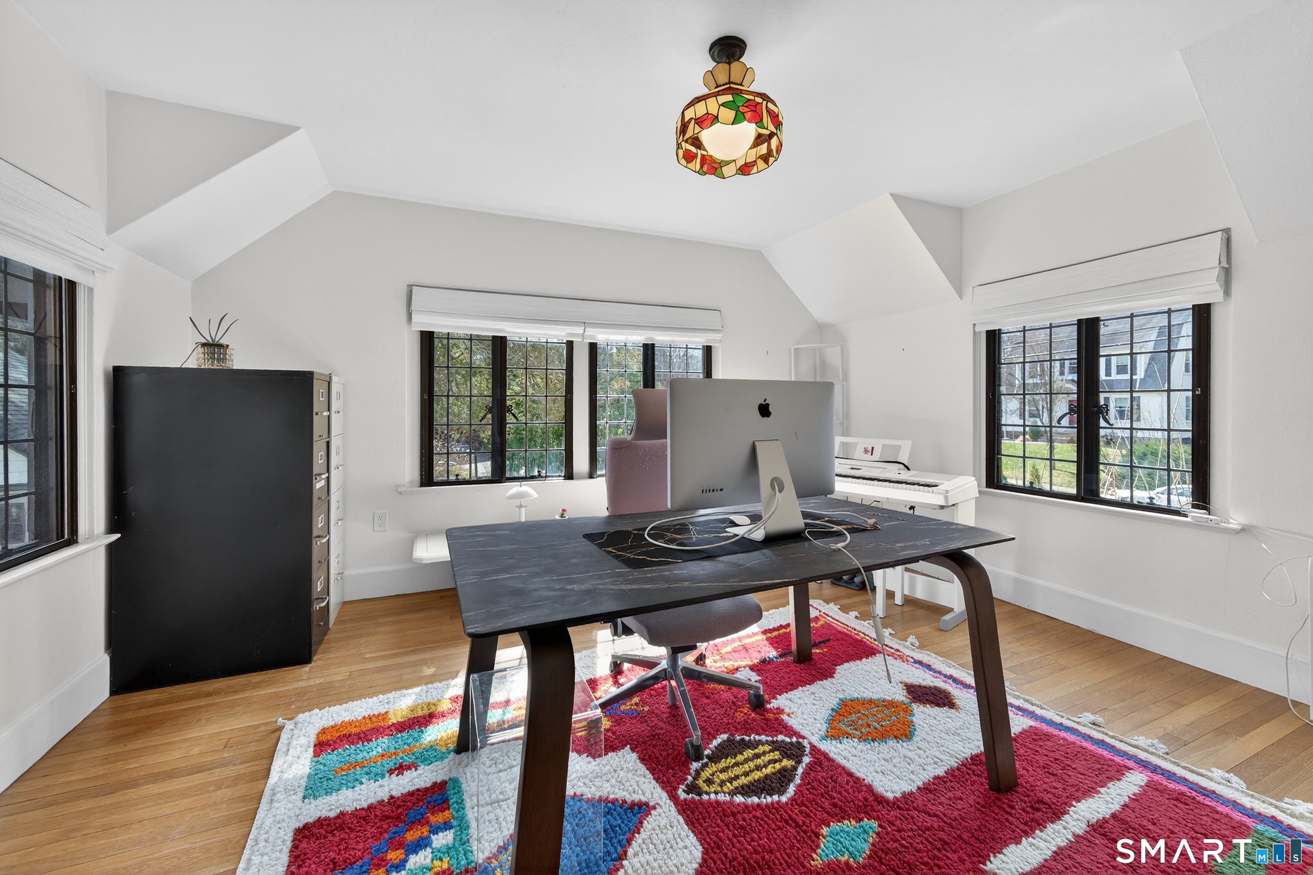 80 Santa Fe Avenue Hamden, CT 06517 - Photo 21 of 28 a view of a dining room with furniture and a window