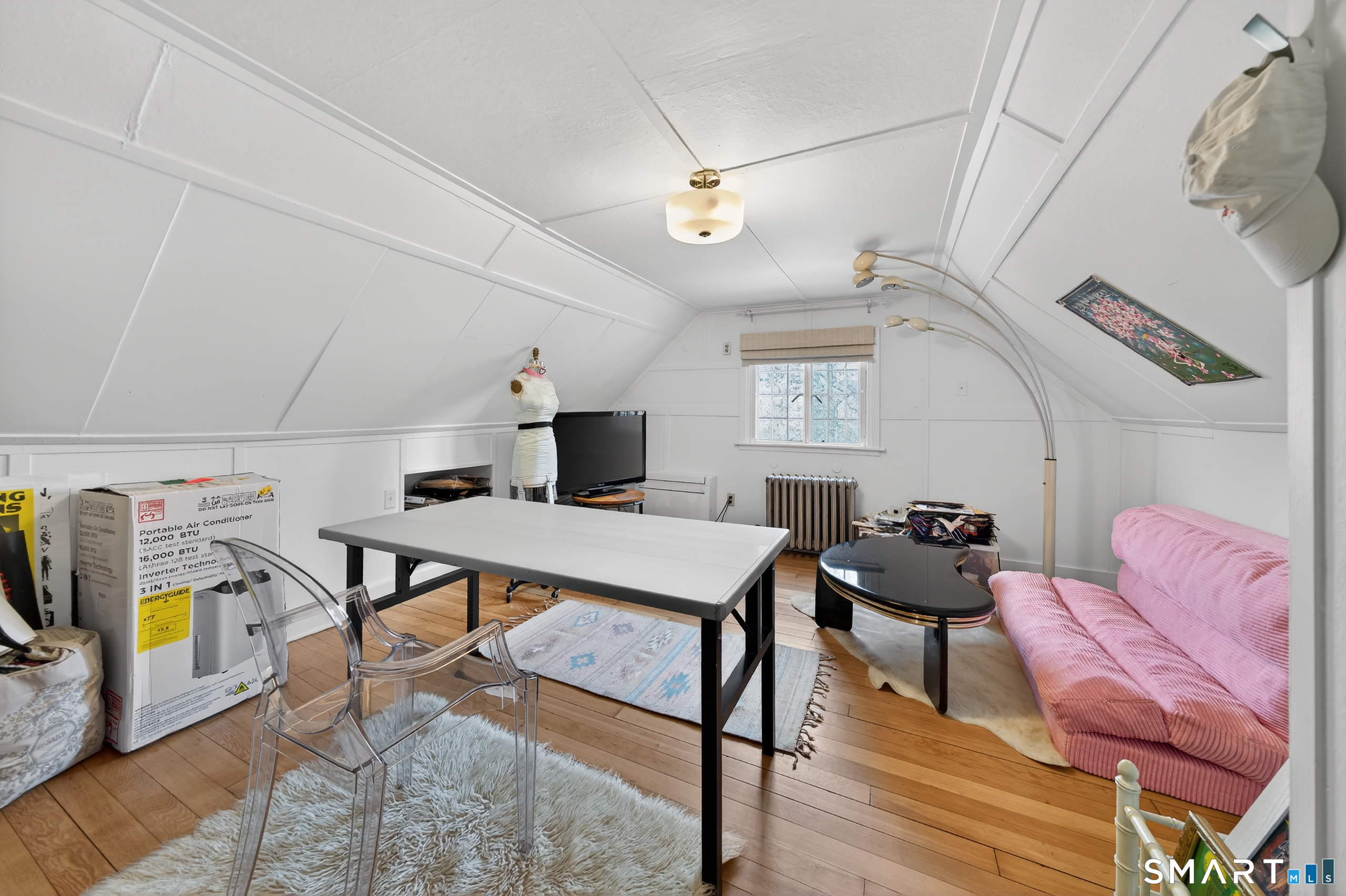 80 Santa Fe Avenue Hamden, CT 06517 - Photo 25 of 28 a living room with furniture a rug and white walls