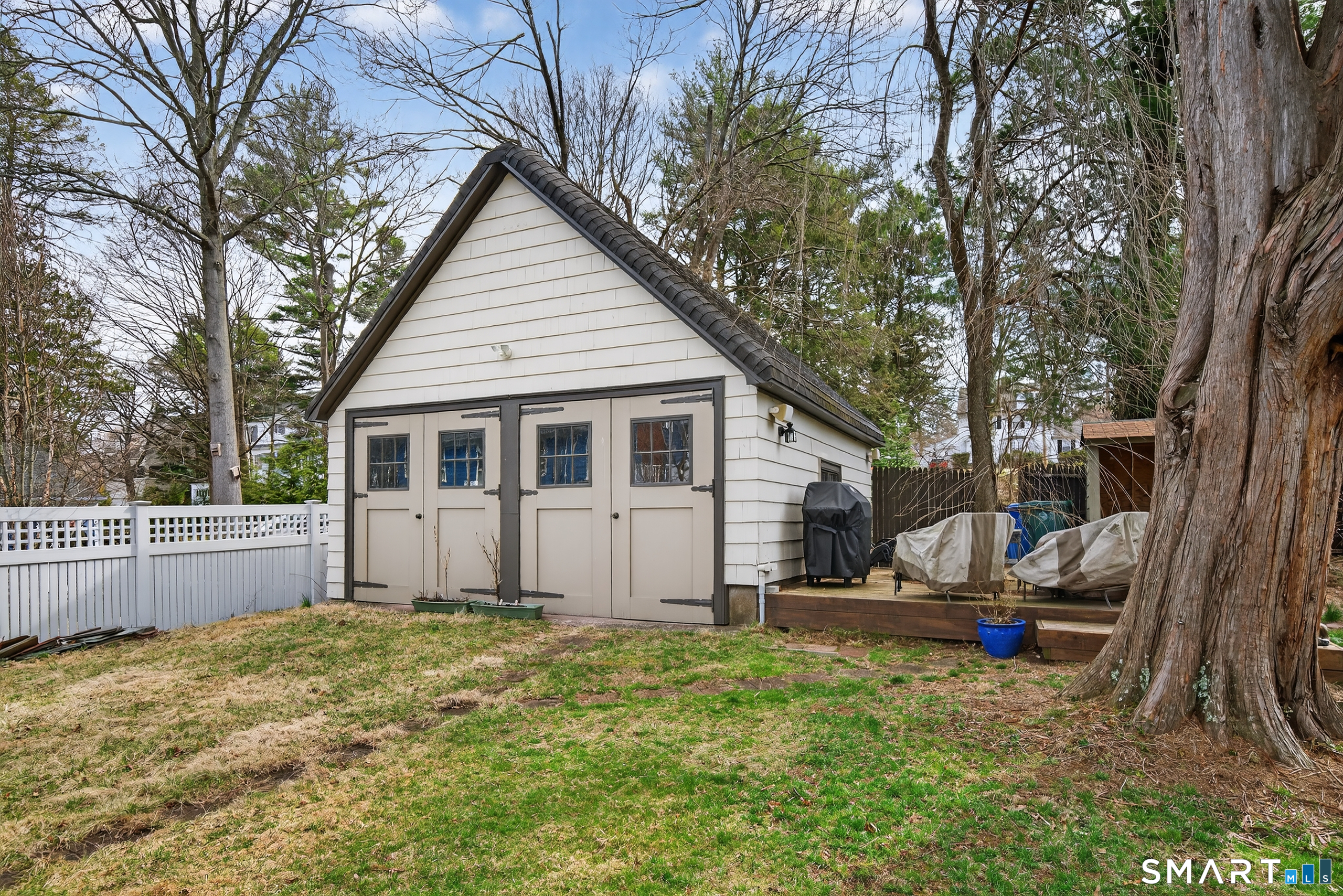 80 Santa Fe Avenue Hamden, CT 06517 - Photo 27 of 28 a view of a house with backyard and trees