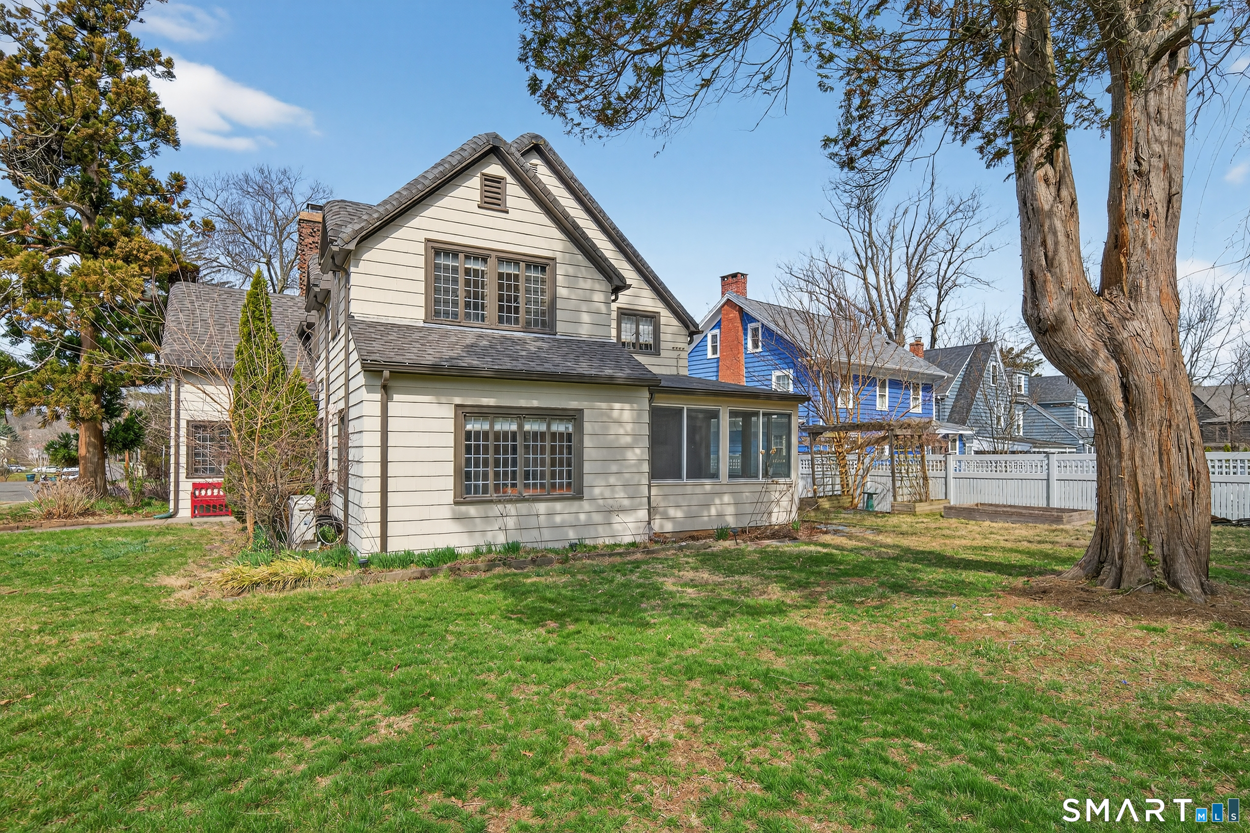 80 Santa Fe Avenue Hamden, CT 06517 - Photo 3 of 28 a front view of a house with a garden