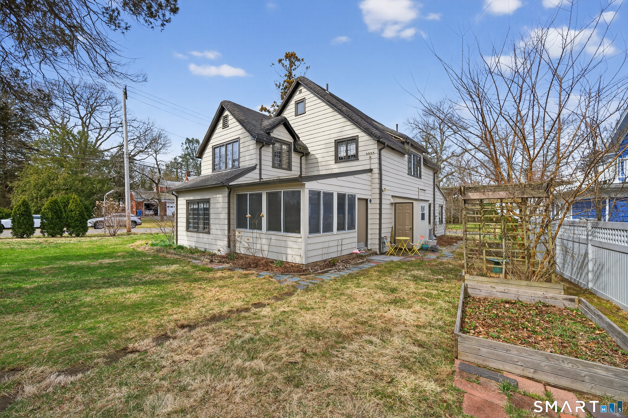 80 Santa Fe Avenue Hamden, CT 06517 - Photo 4 of 28 a front view of a house with a yard