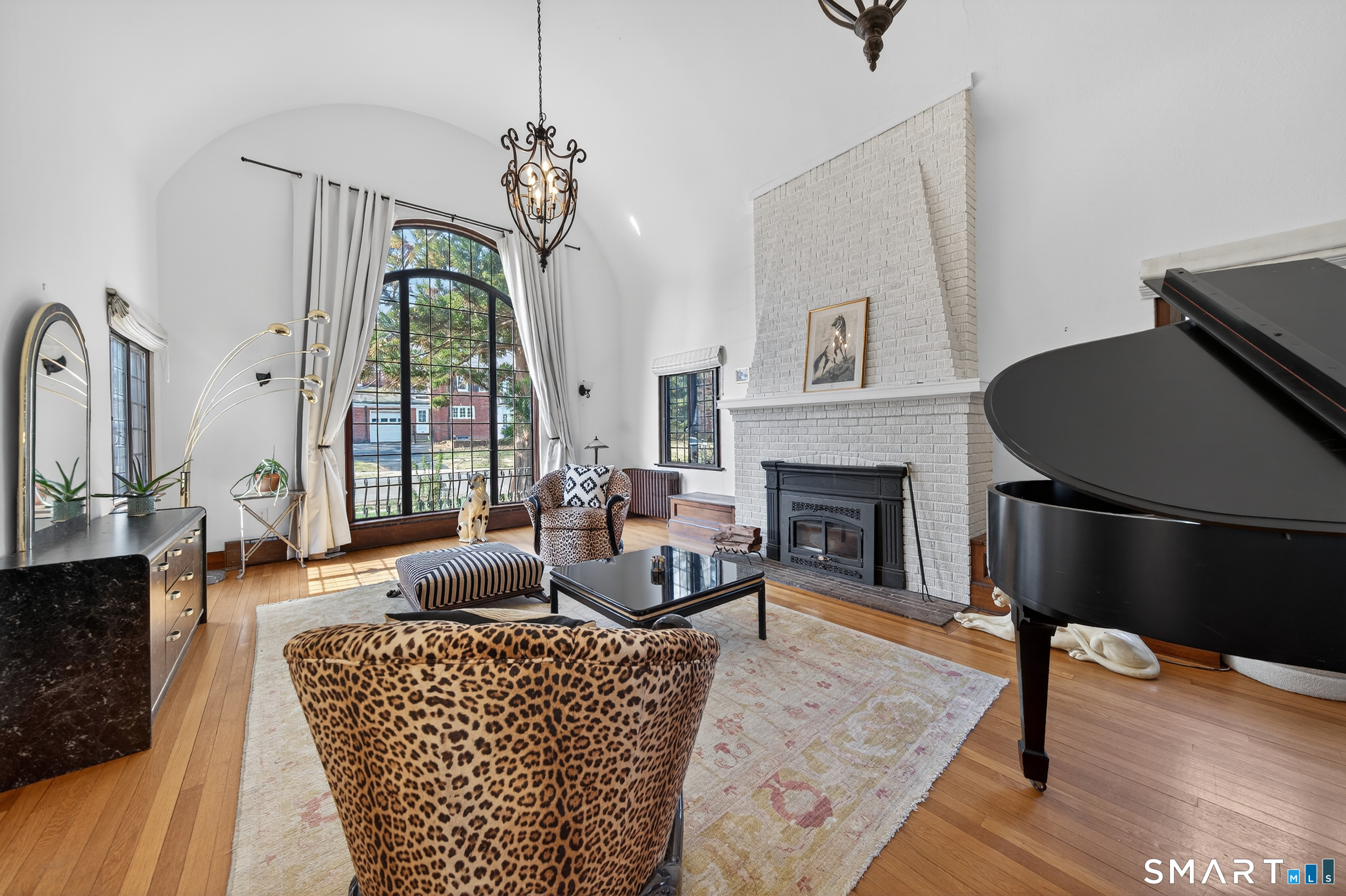 80 Santa Fe Avenue Hamden, CT 06517 - Photo 6 of 28 a living room with furniture a large window and a fireplace
