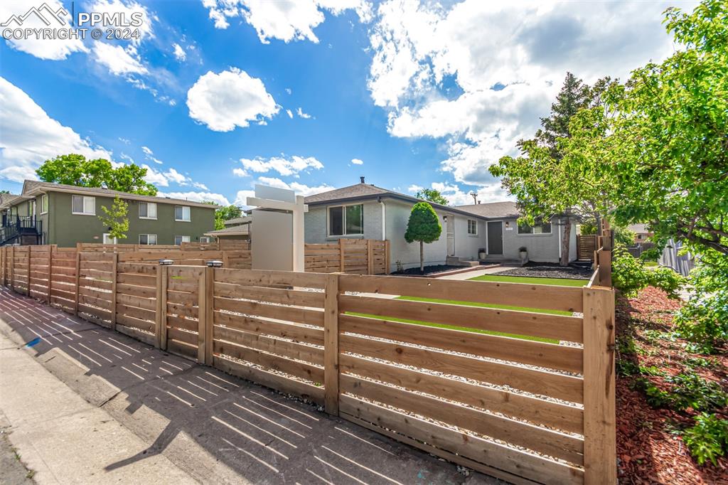 737 Utica Street Denver, CO 80204 - Photo 1 of 41 a front view of a house with garden