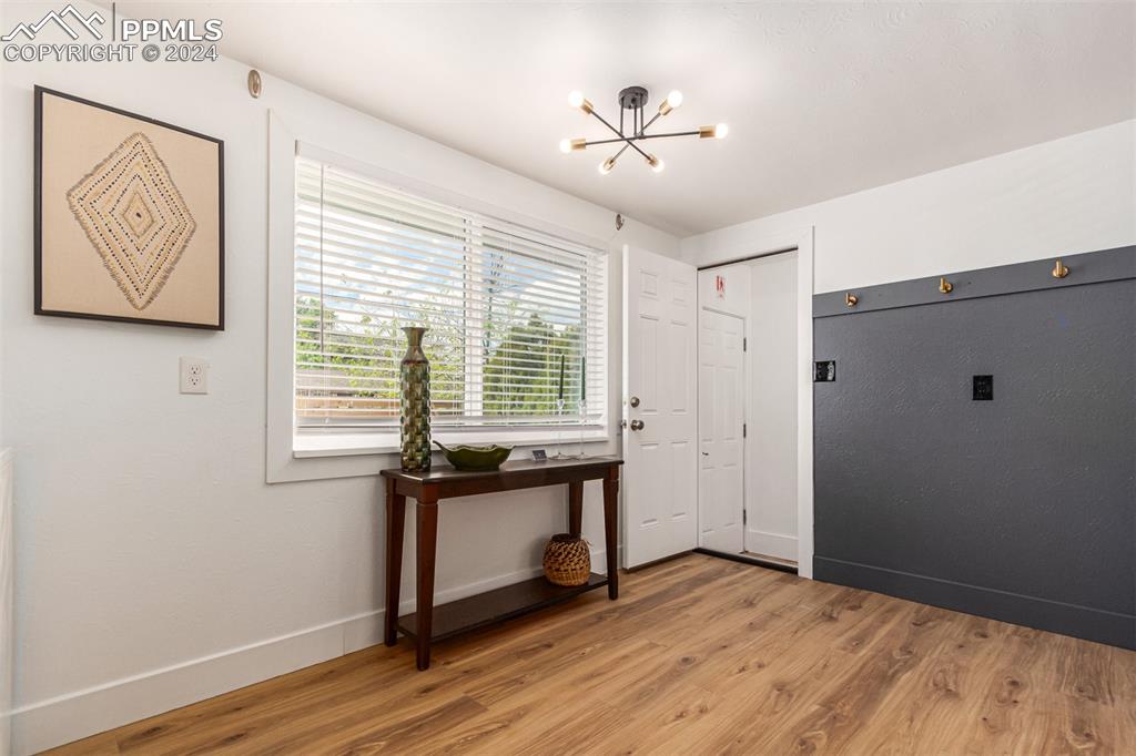 737 Utica Street Denver, CO 80204 - Photo 14 of 41 a view of empty room with wooden floor and fan