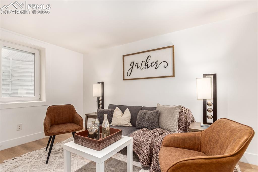 737 Utica Street Denver, CO 80204 - Photo 17 of 41 a living room with furniture and a chair