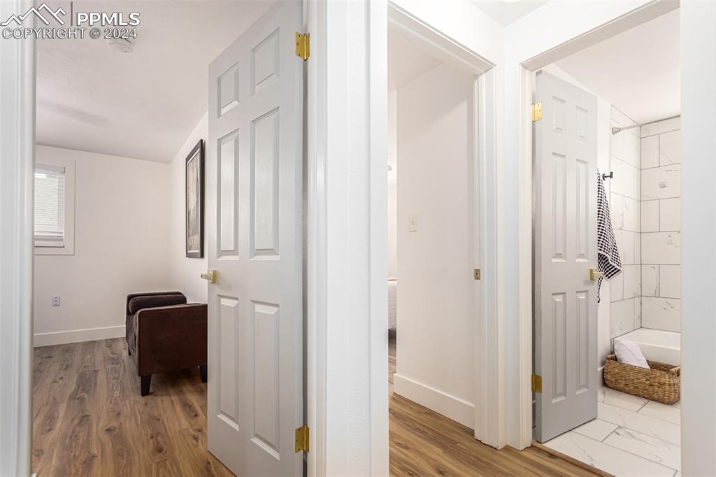 737 Utica Street Denver, CO 80204 - Photo 19 of 41 a walk in closet with wooden floor and closet